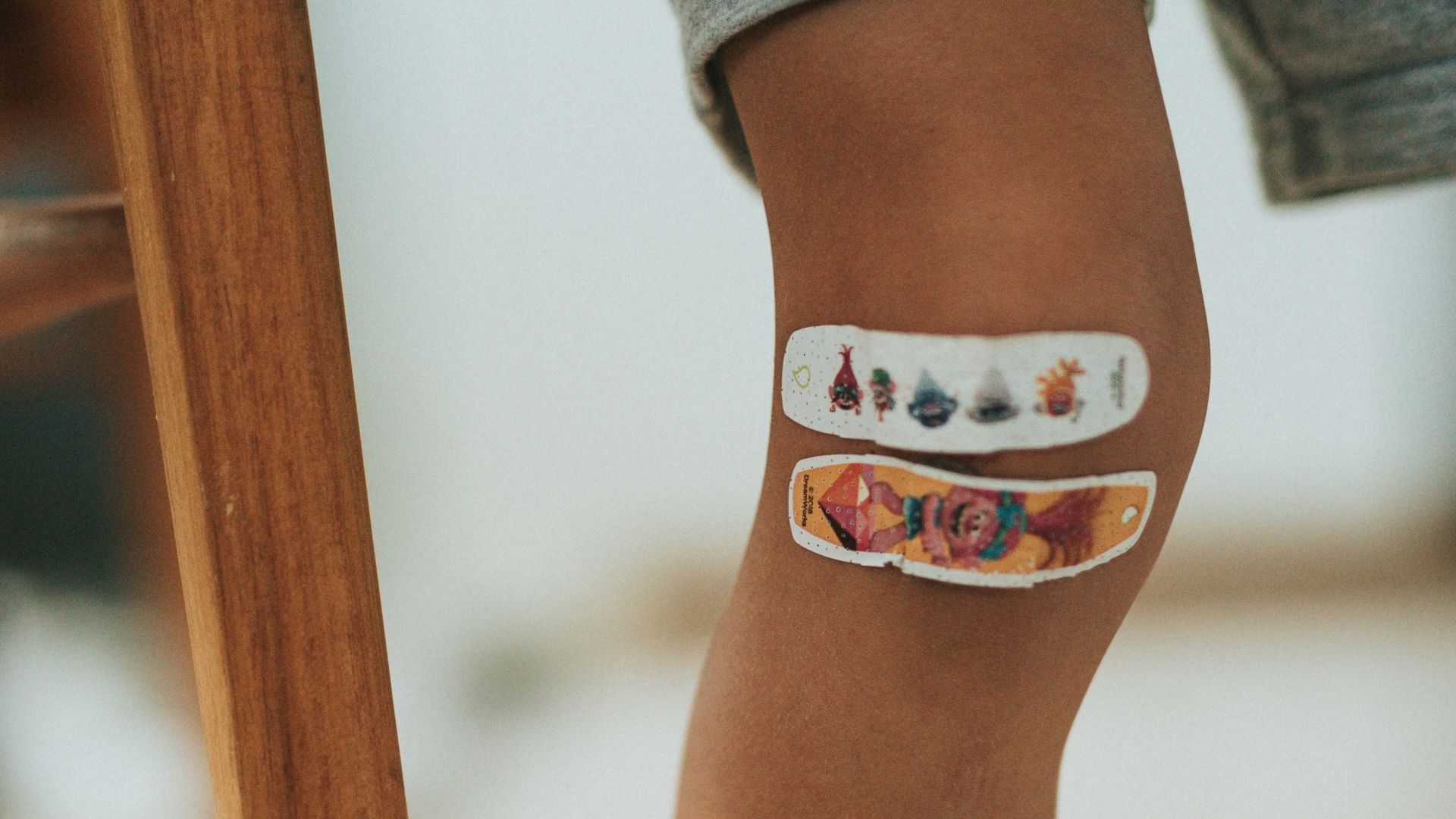 person wearing orange and white cat tattoo