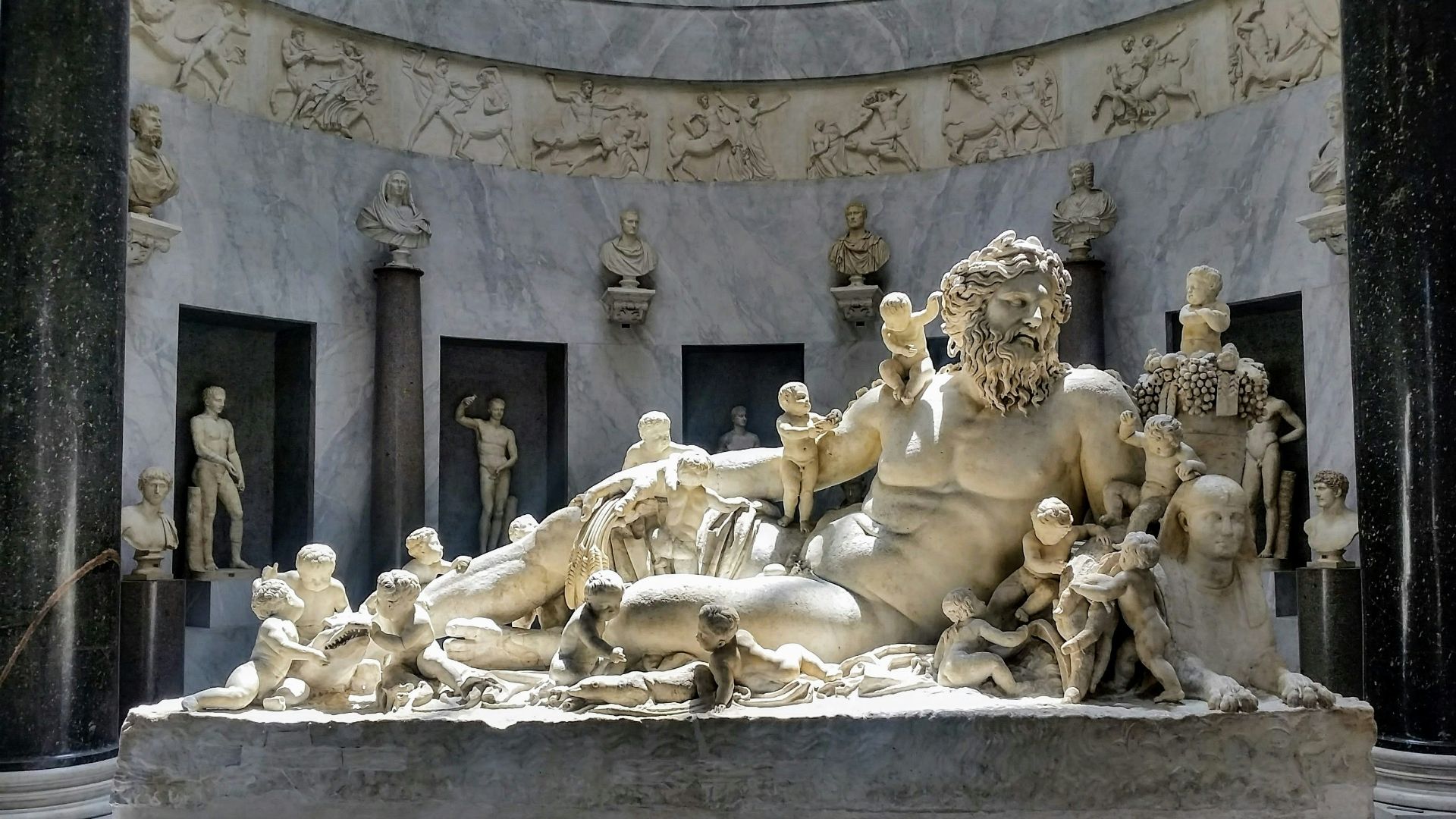 statue on topless man