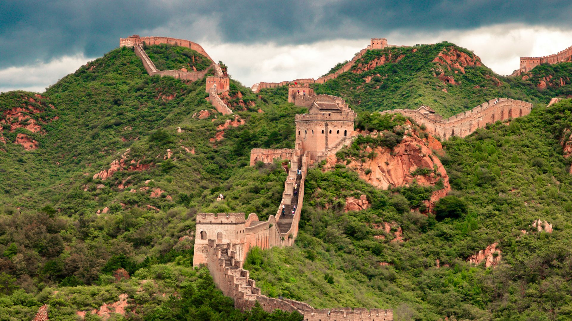 brown concrete building on top of hill