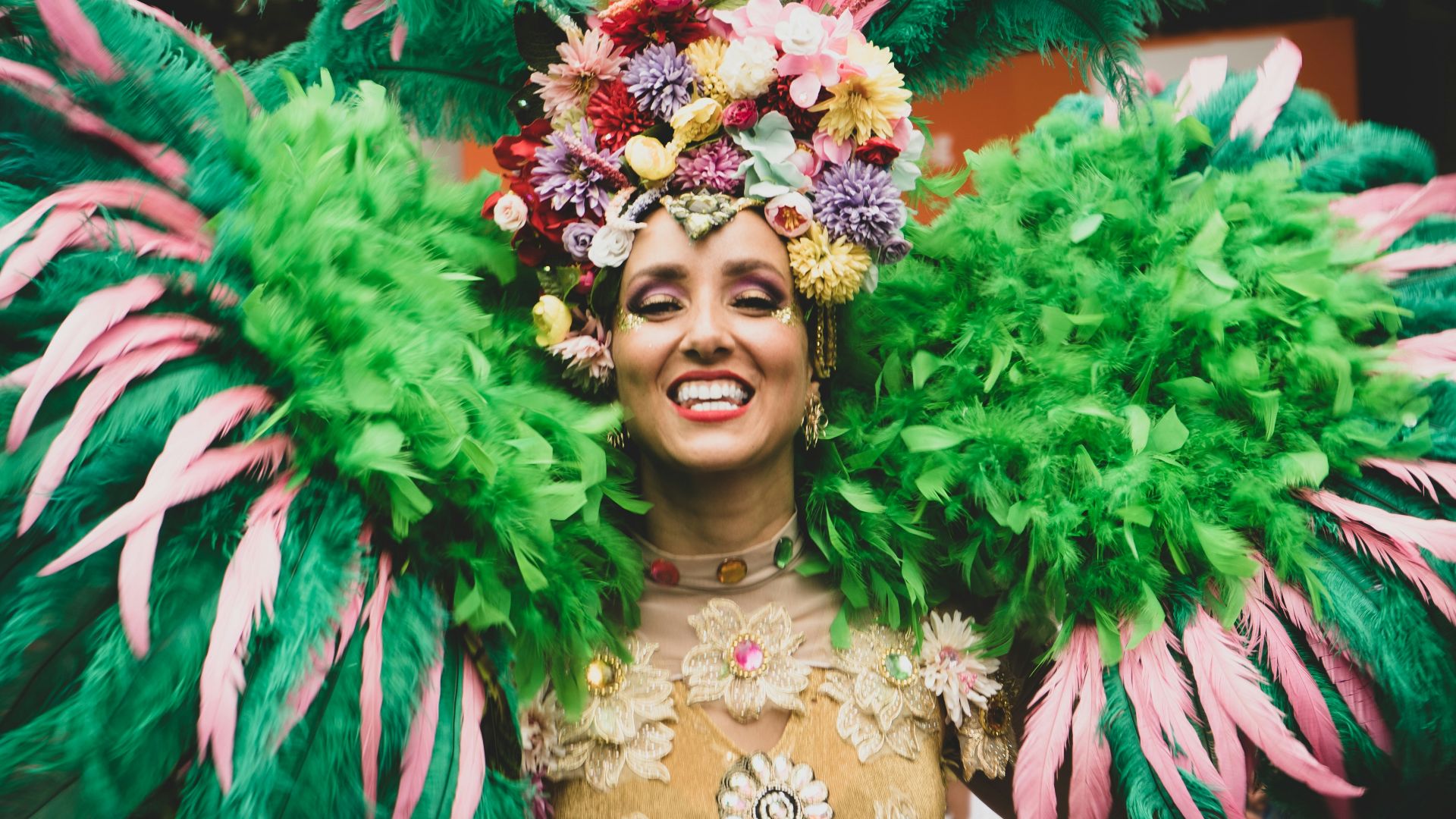 a woman in a green and pink costume