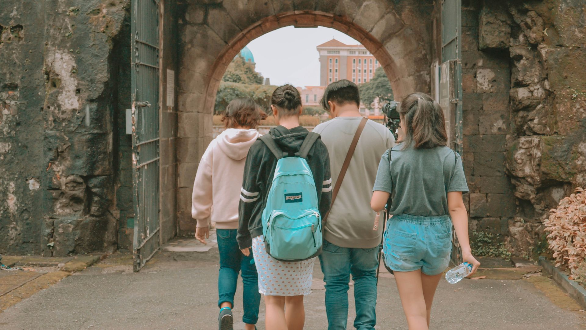 man and woman walking on pathway during daytime