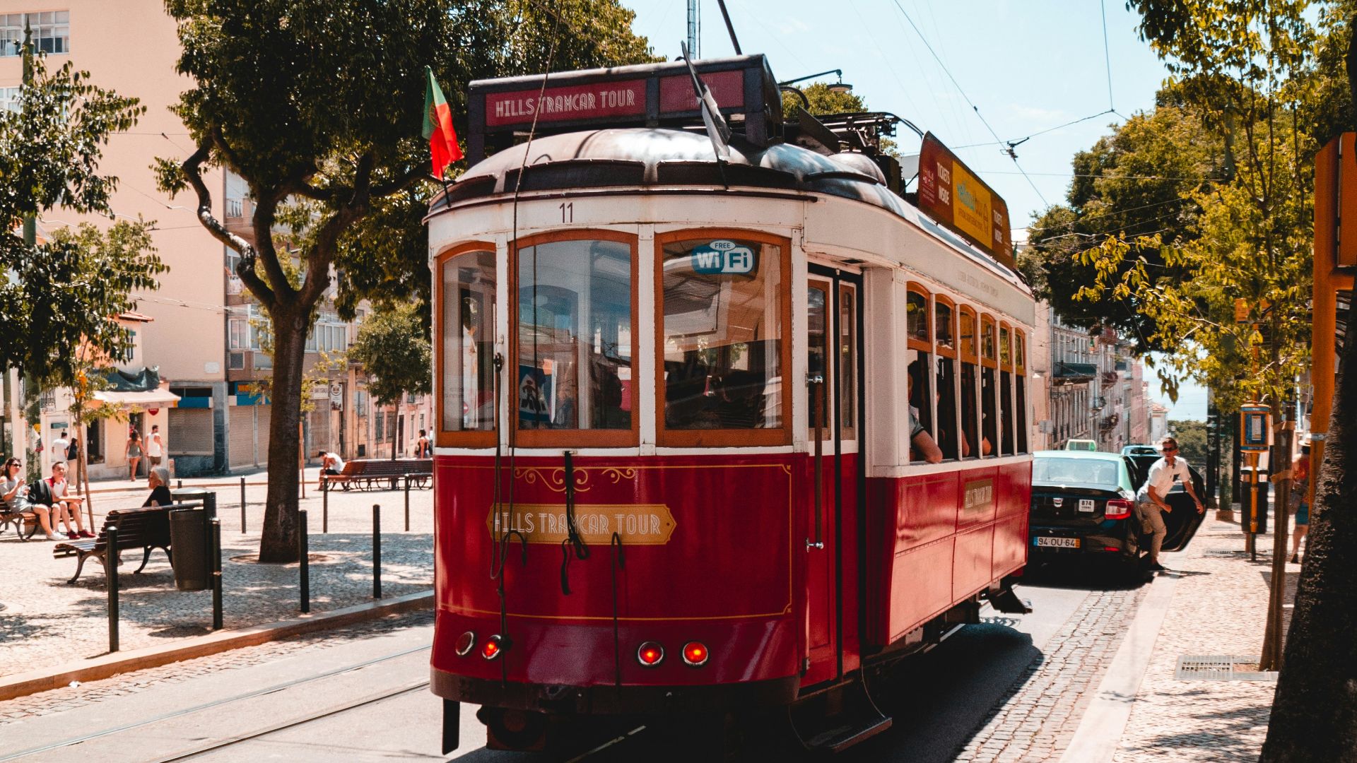 red and white tram on road during daytime