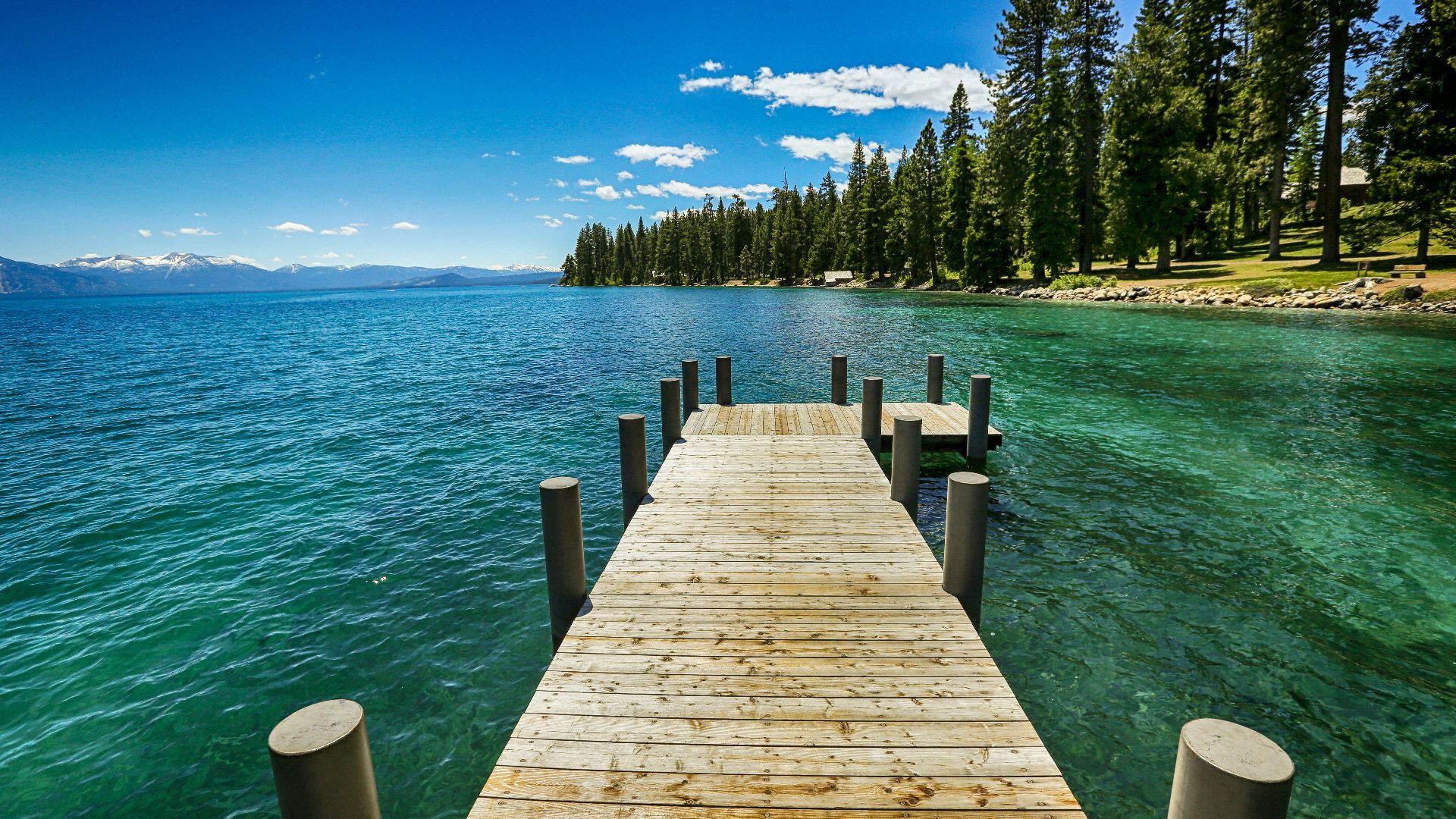 brown wooden dock on blue sea under blue sky during daytime