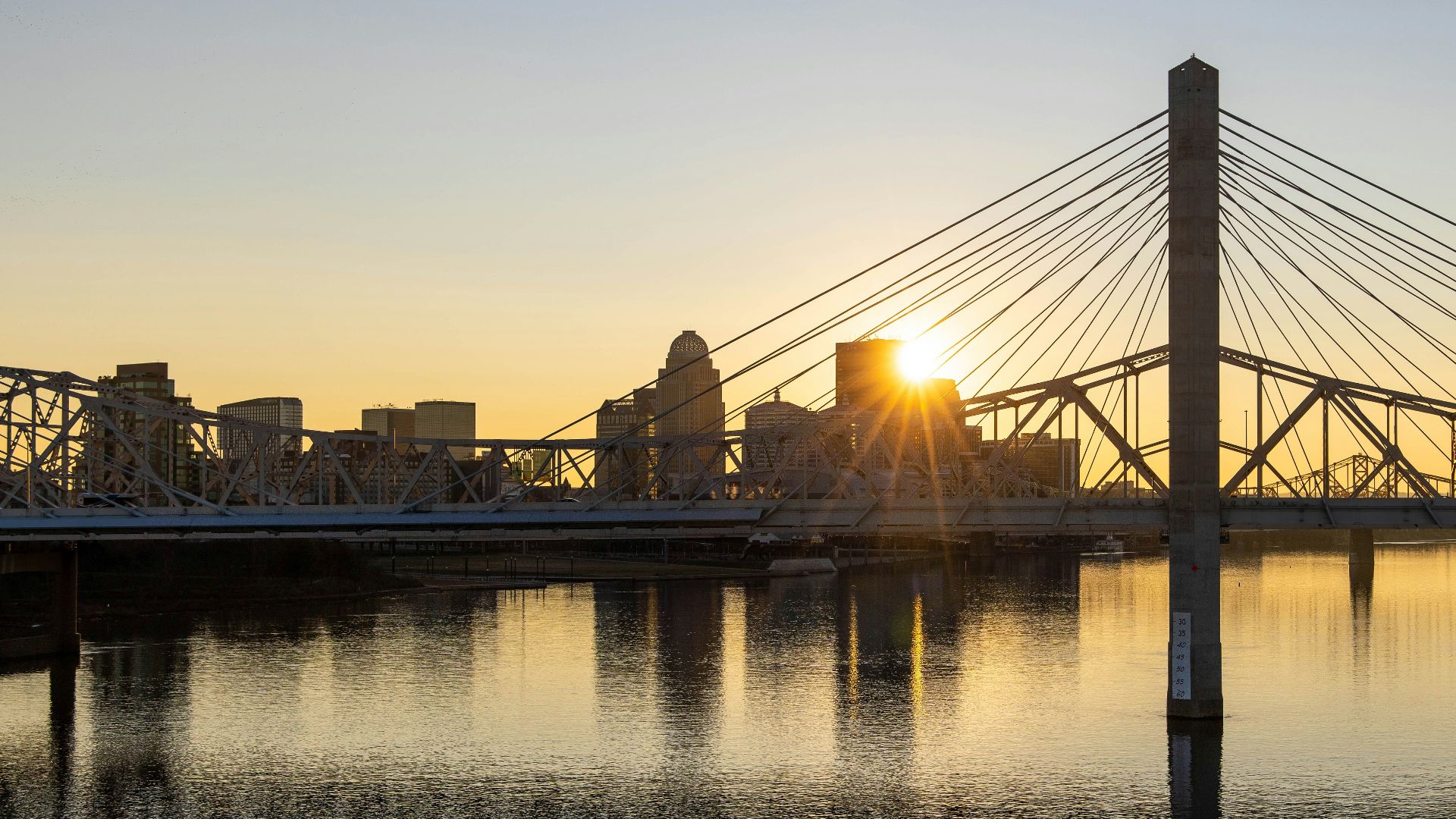 bridge over water during sunset