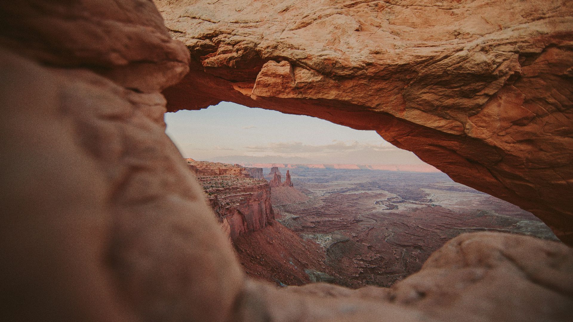 a rock formation with a hole in the middle of it