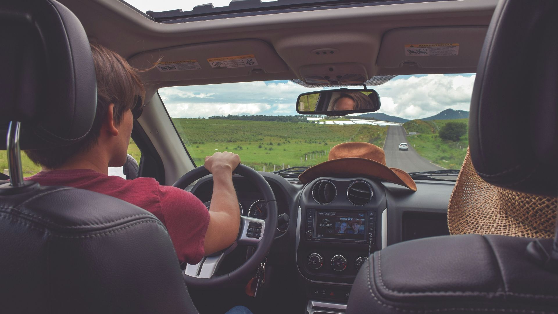 man driving straight on pathway during day time