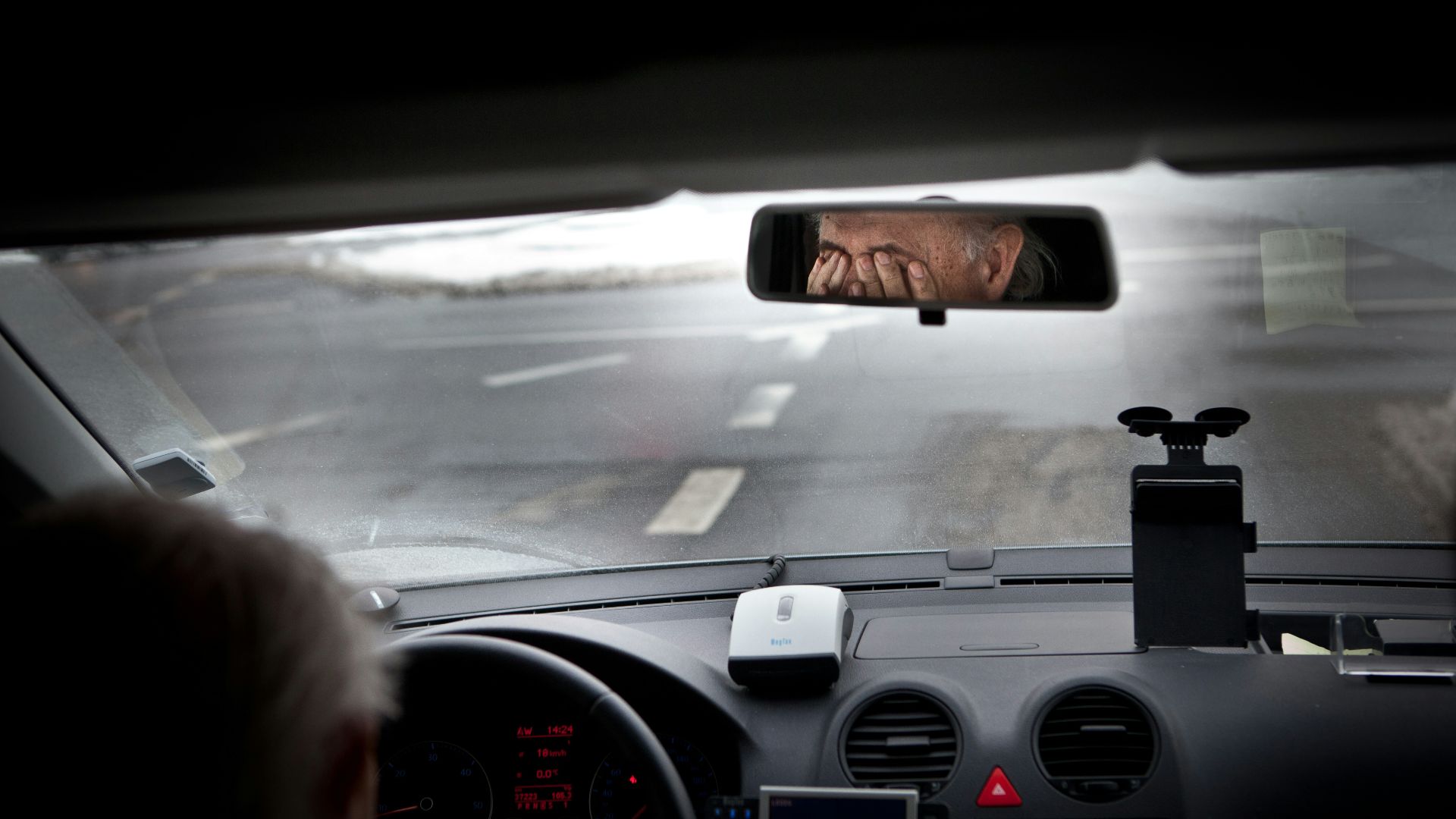 person driving car during daytime