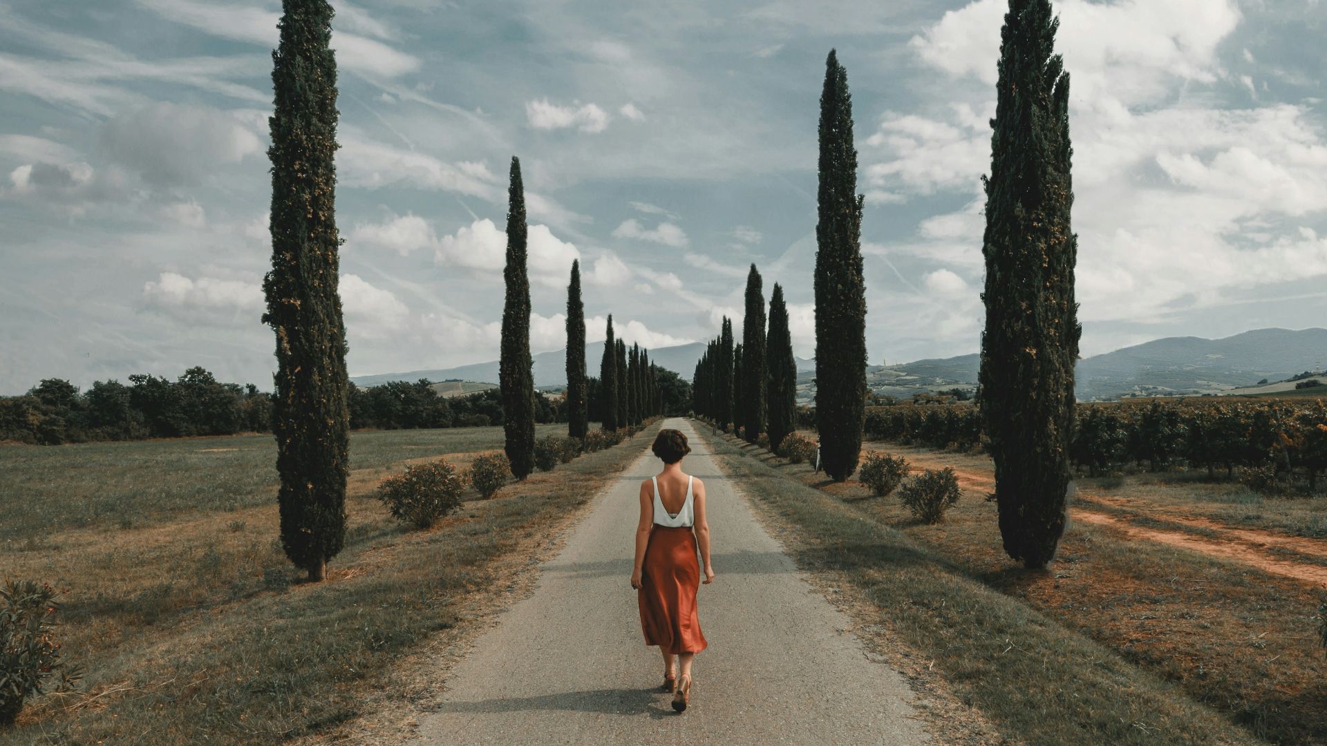 woman standing in the middle of road