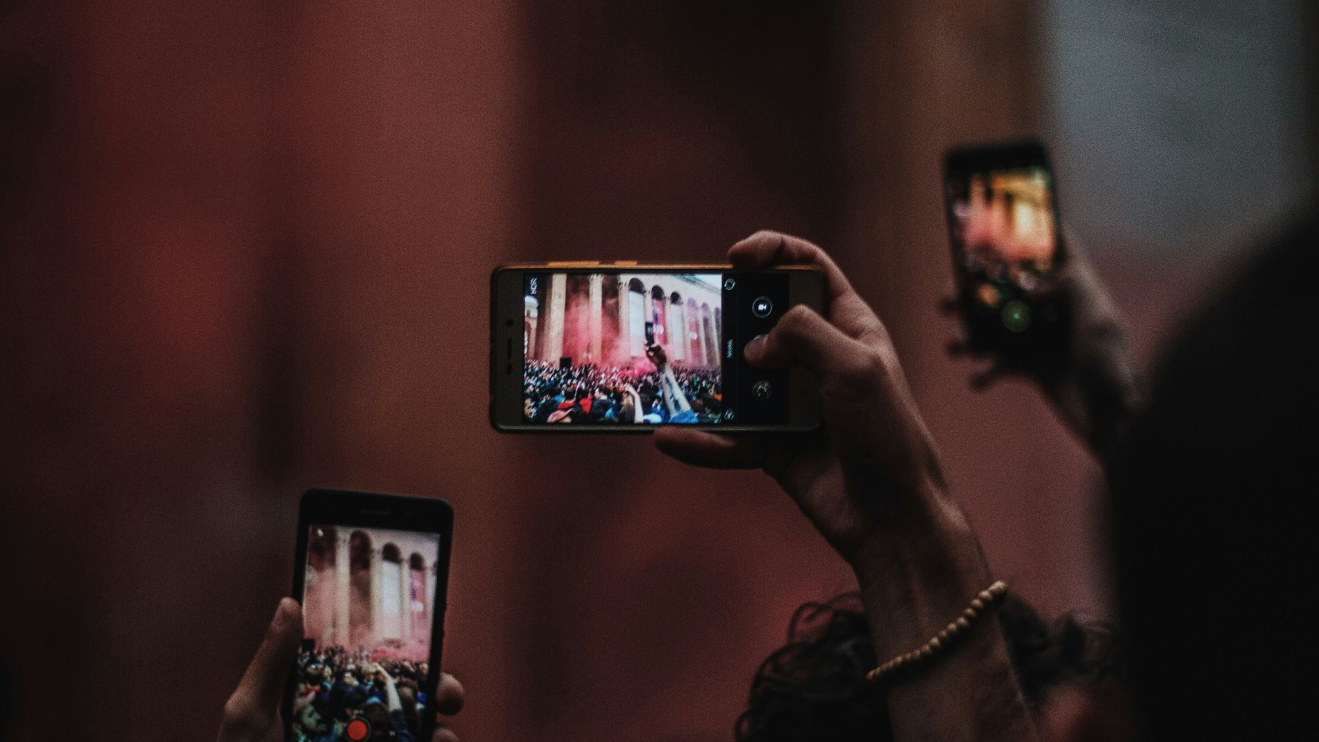 people holding smartphones