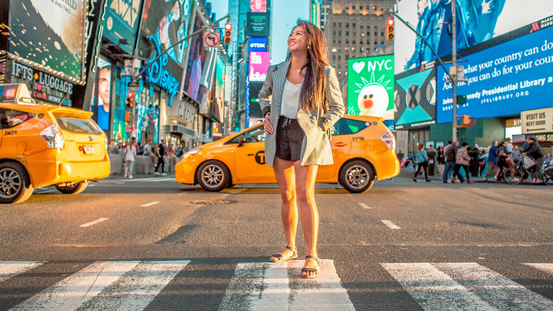 woman standing on pedestrian lane