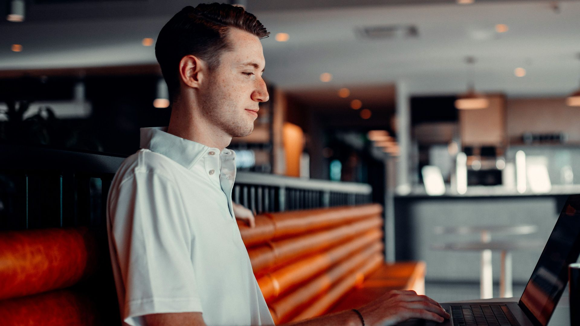 man in white button up shirt holding black tablet computer