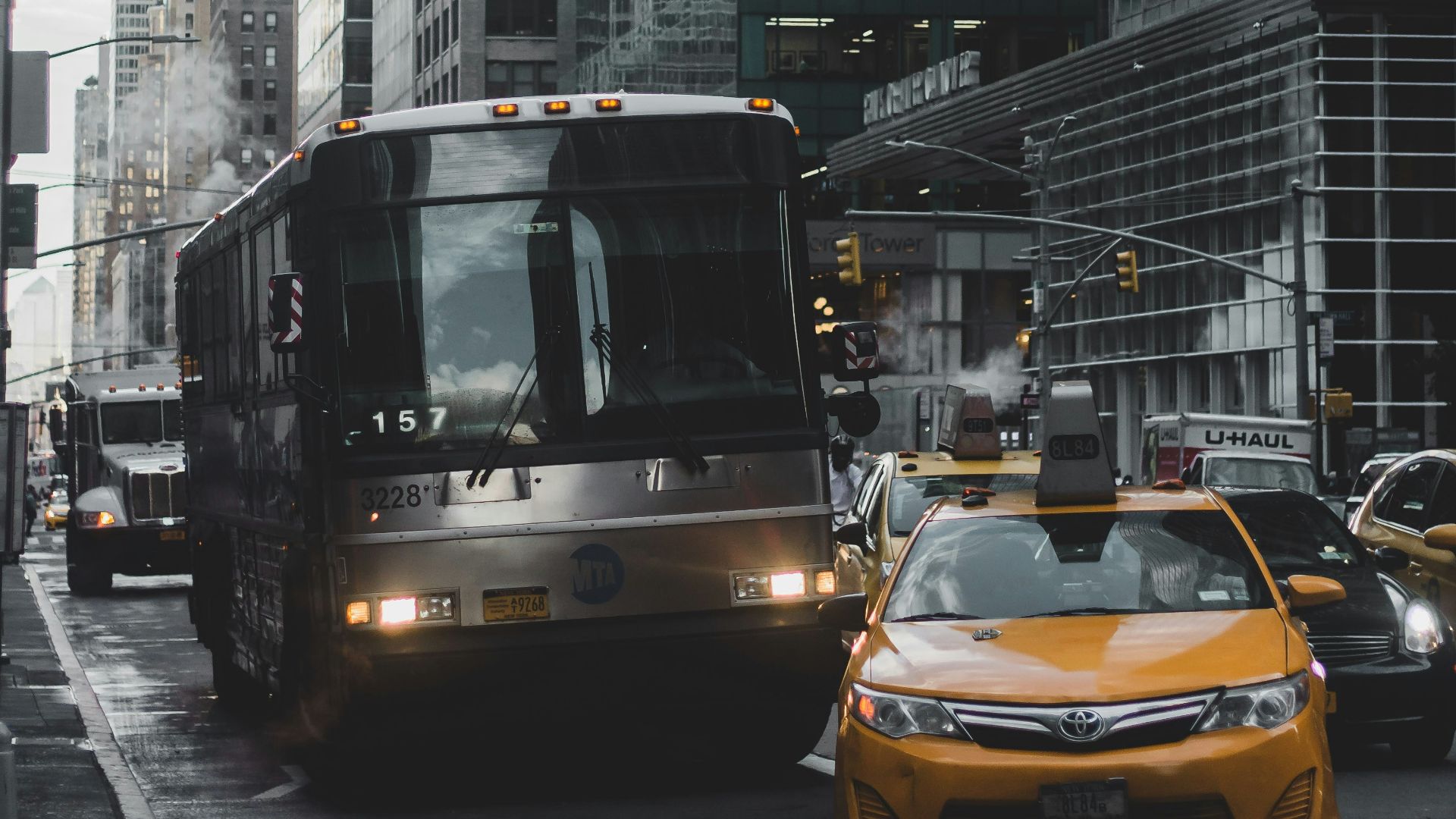 cars on road near buildings during daytime