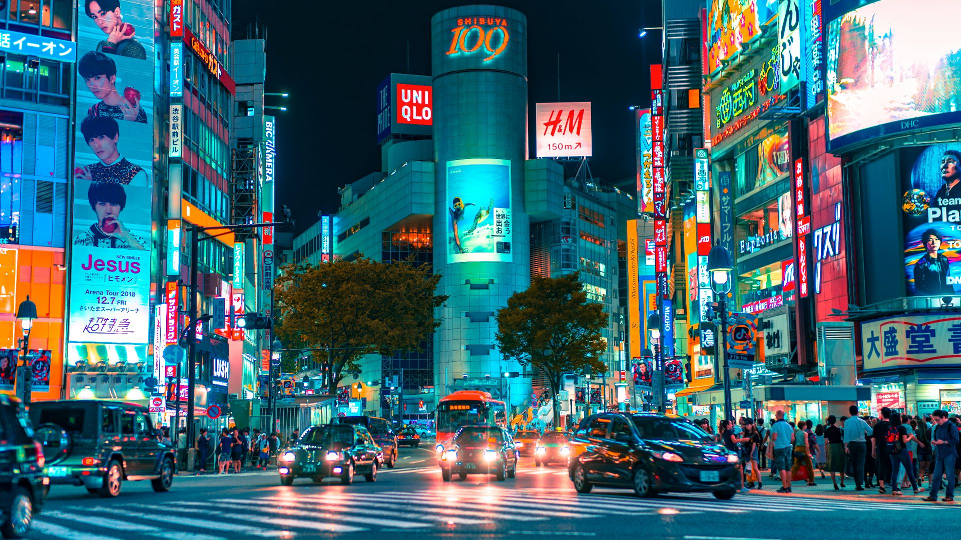 people gathered outside buildings and vehicles