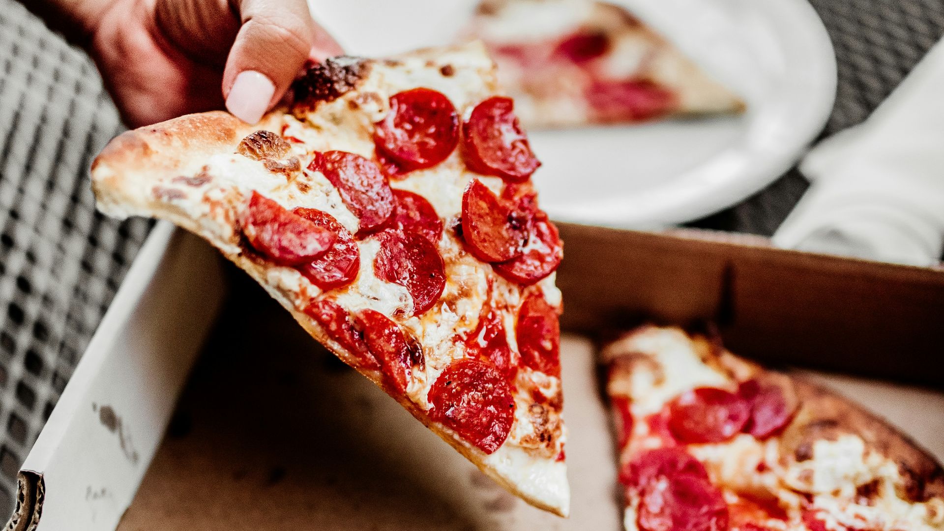sliced pizza on white ceramic plate