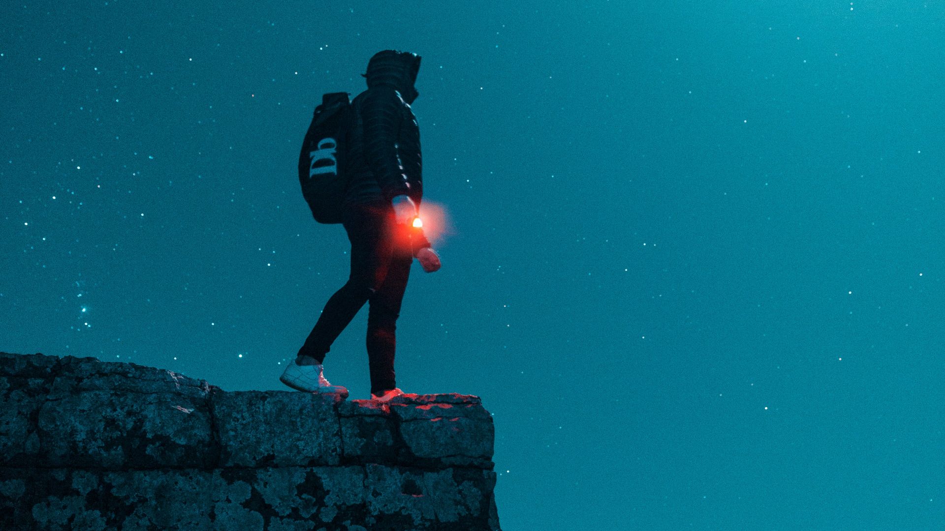 man standing on cliff