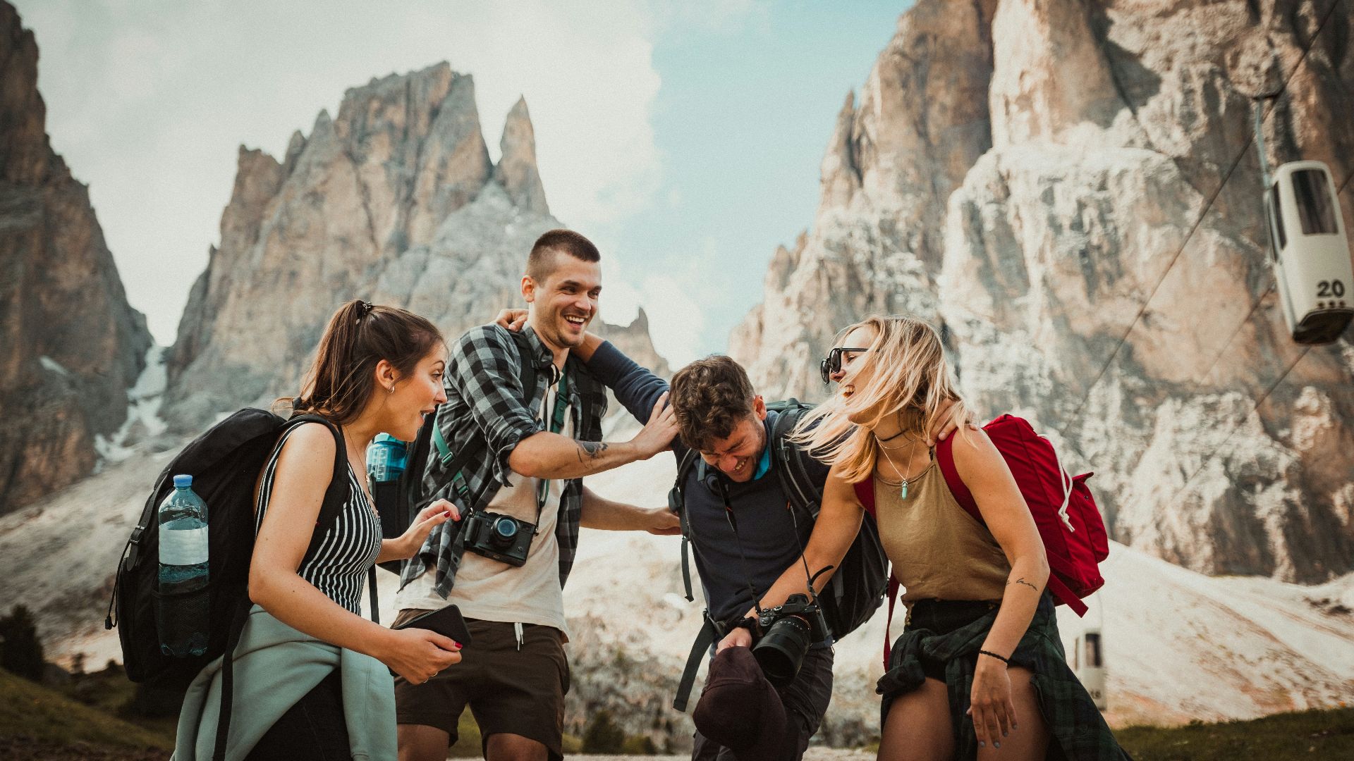 low-angle photography of two men playing beside two women
