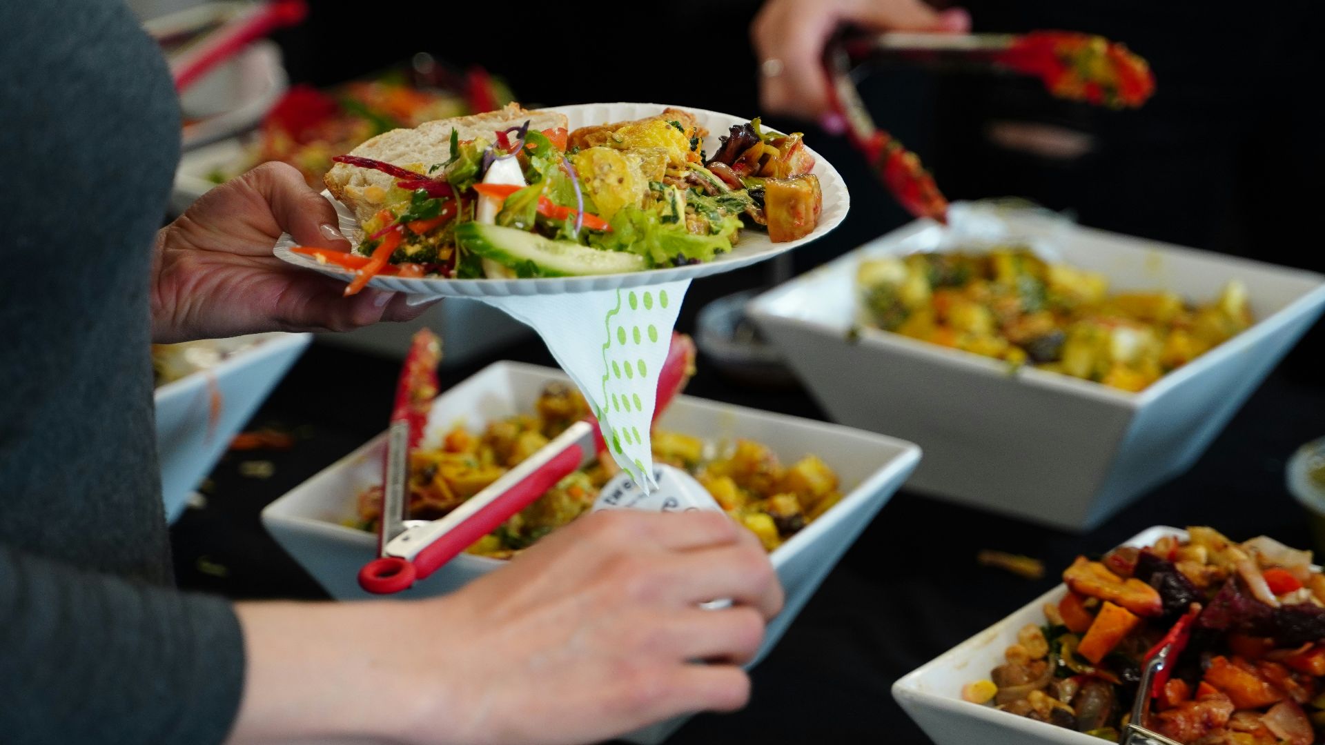 person holding white ceramic bowl with food