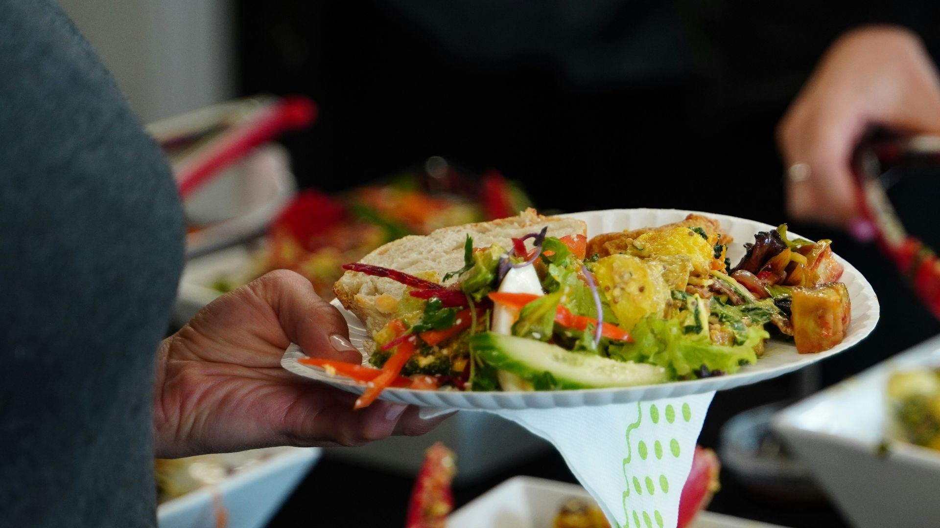 person holding white ceramic bowl with food
