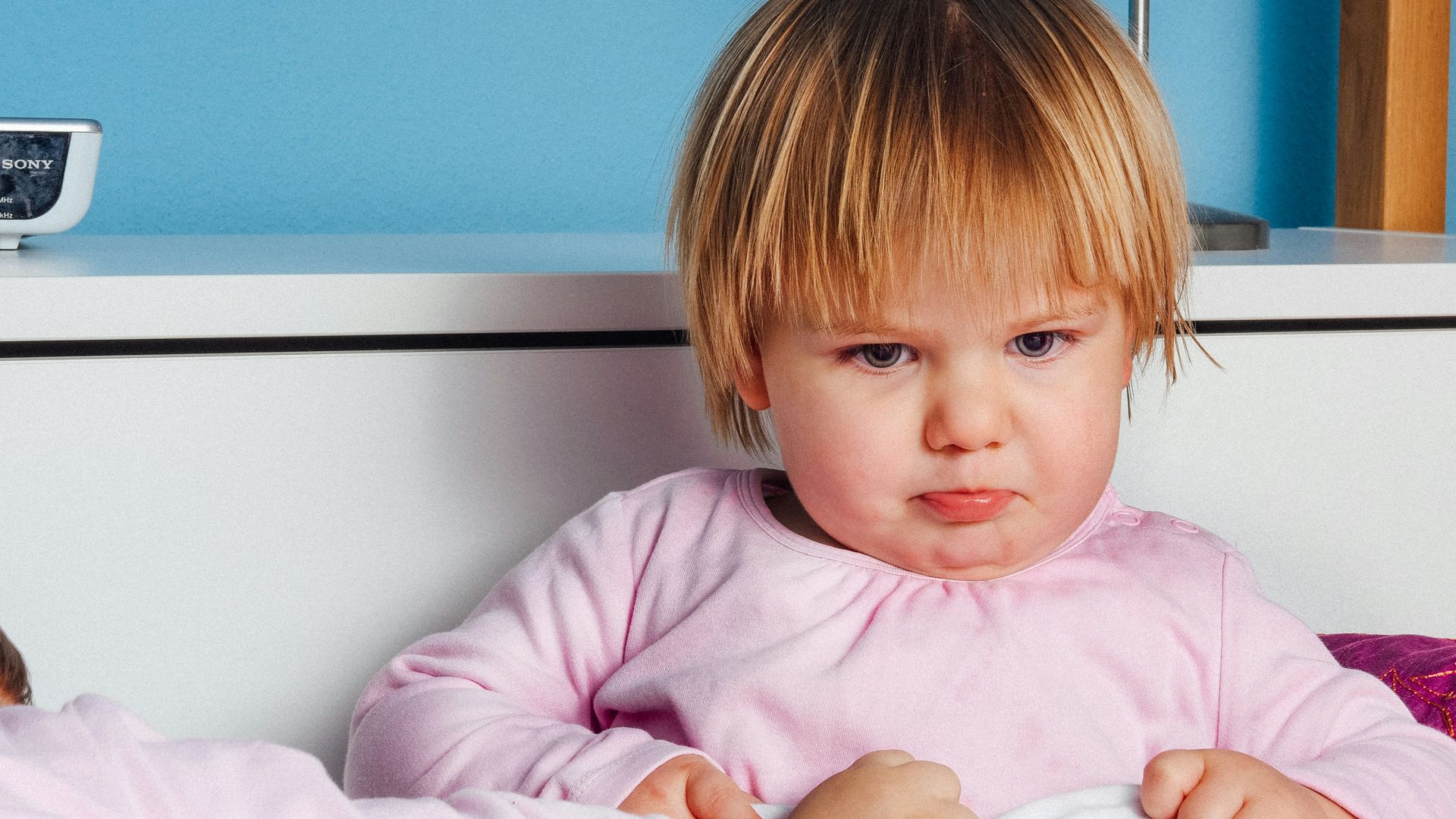 boy wearing pink long-sleeved top