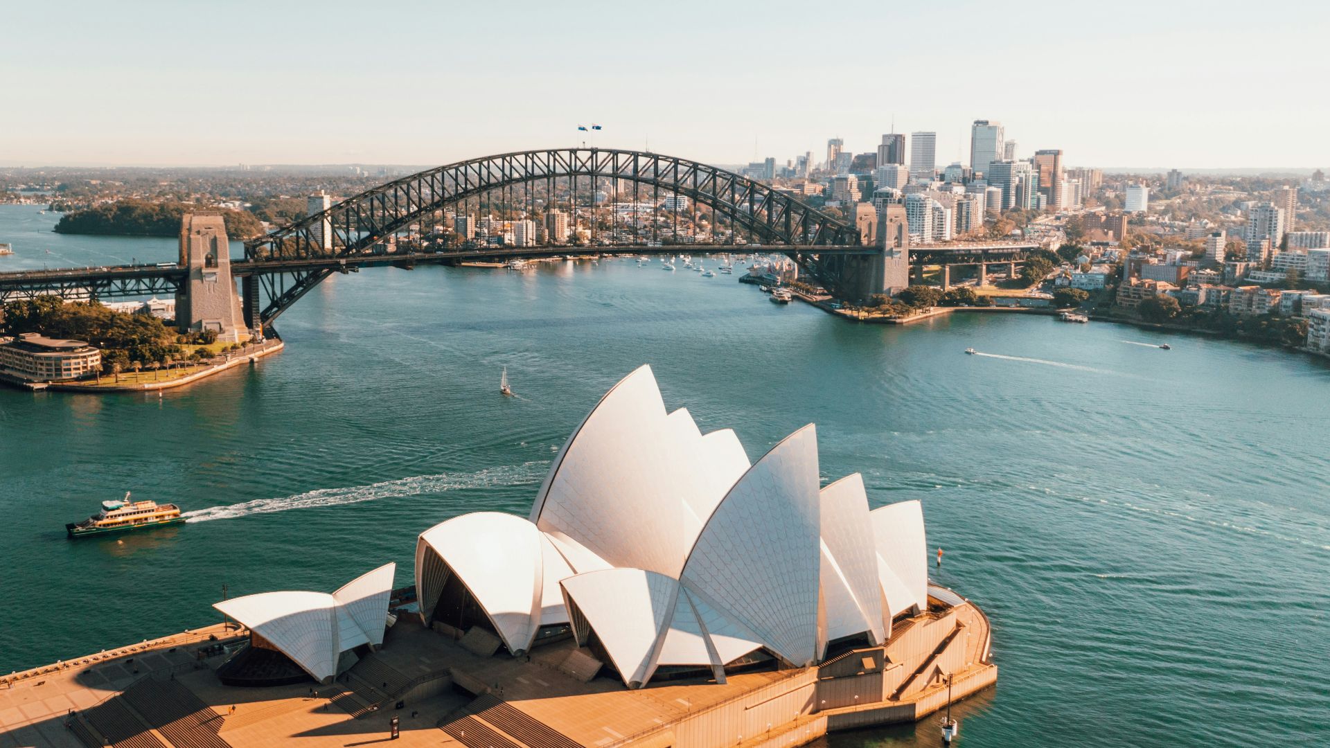 sydney opera house near body of water during daytime