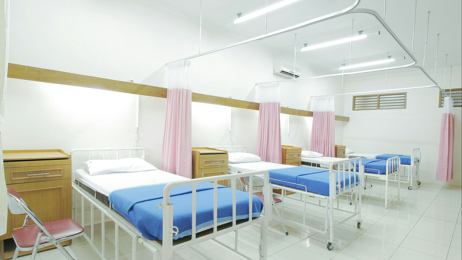 empty hospital bed inside room