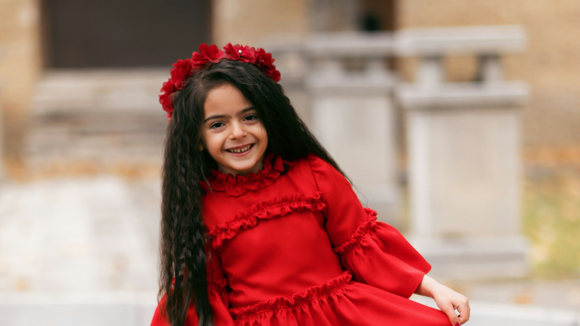 smiling girl holding her dress