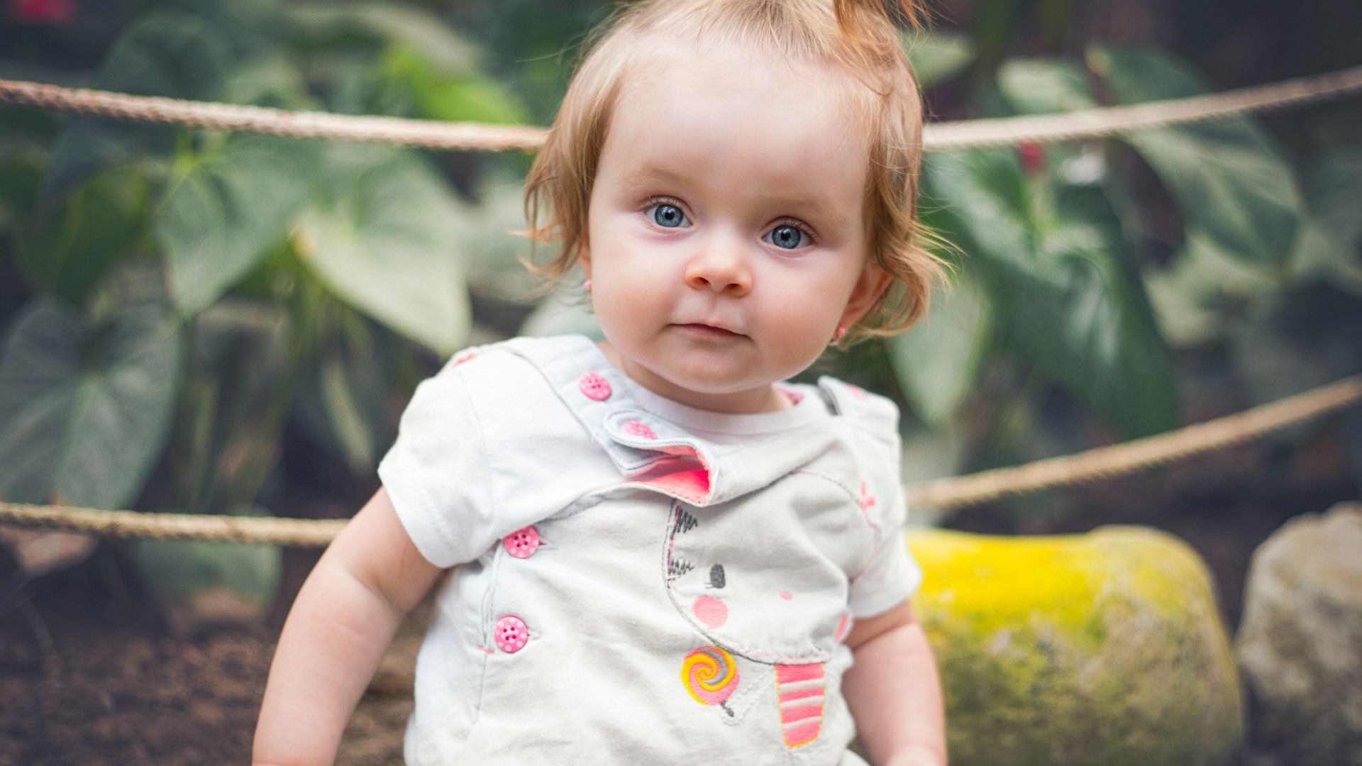 girl in white and pink floral dress