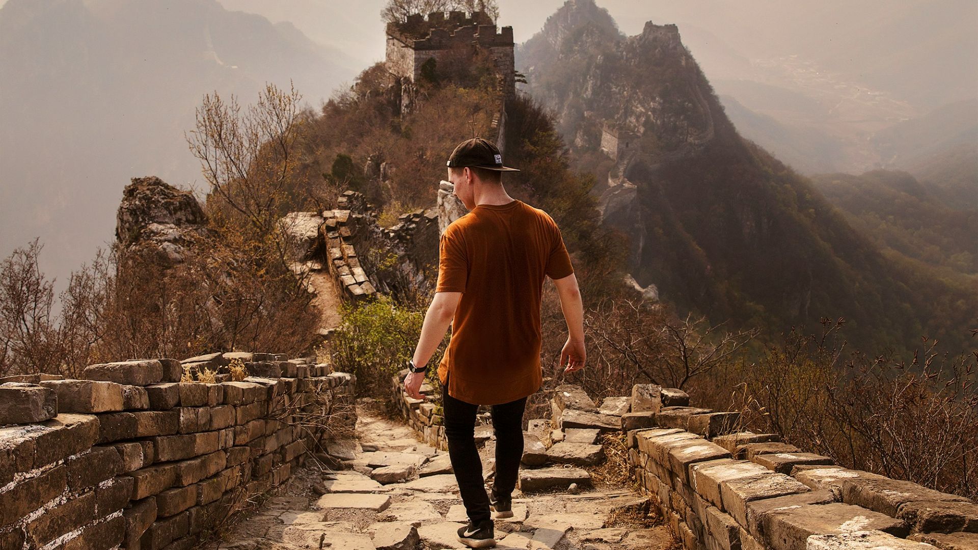 man walking on Great Wall of China
