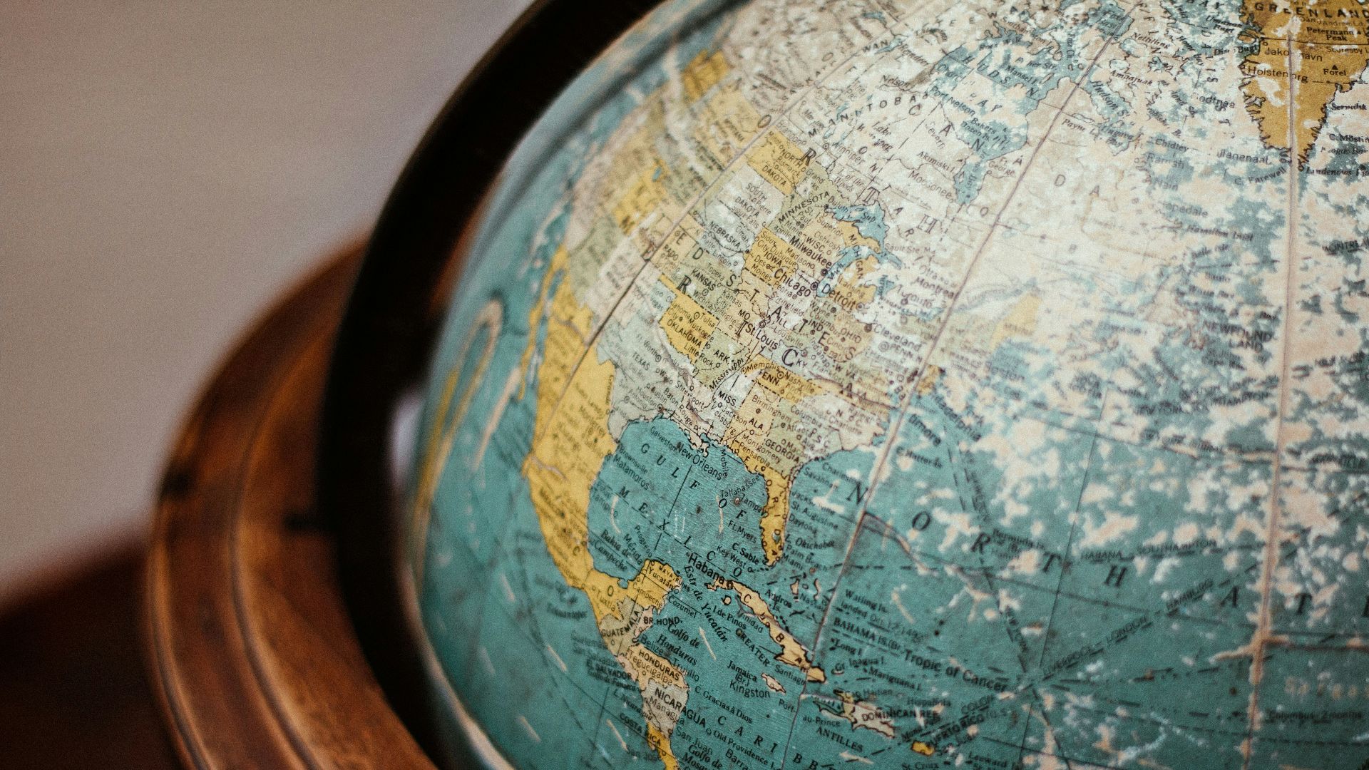 blue earth globe on table