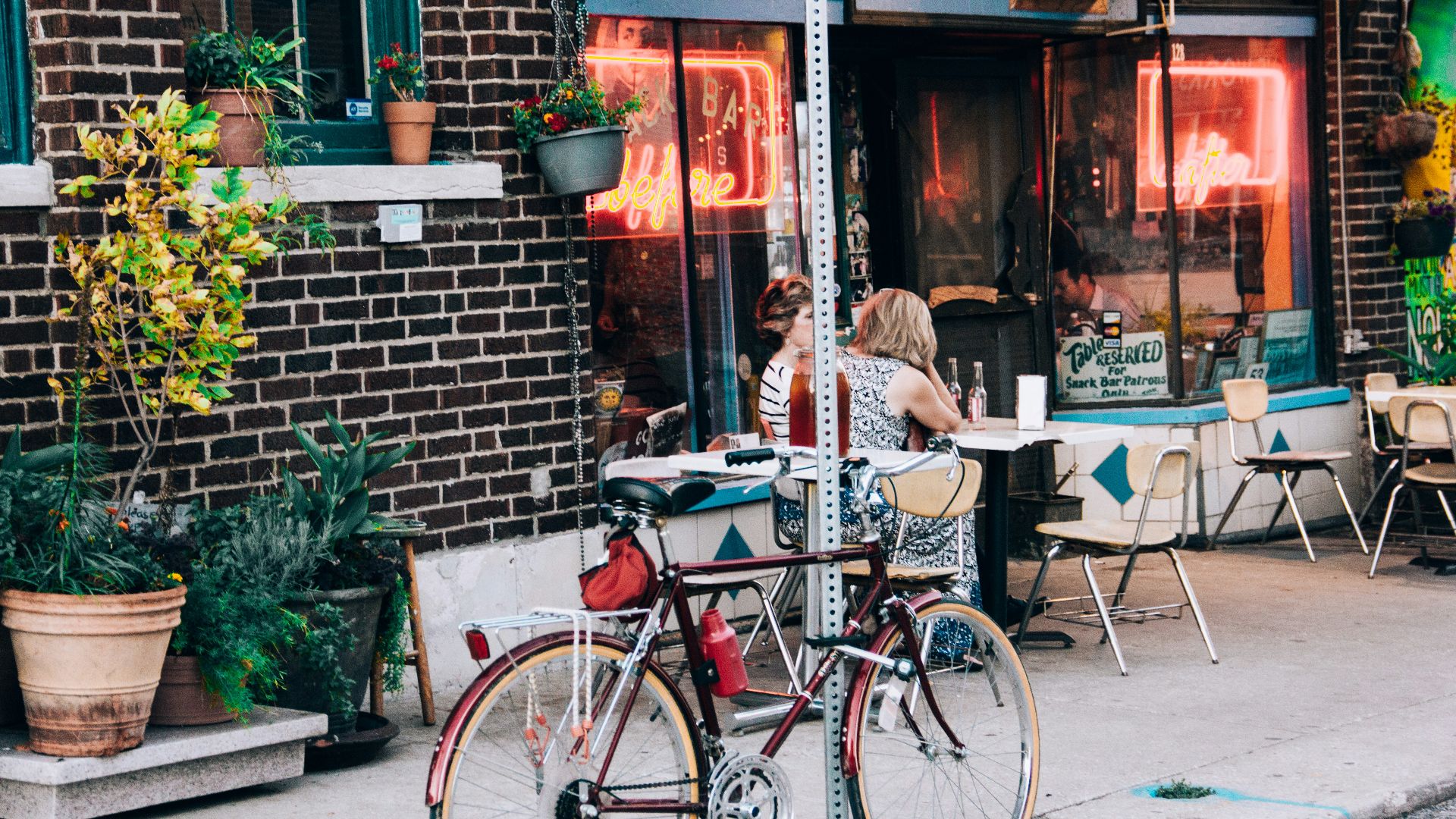 red bicycle park on gray road