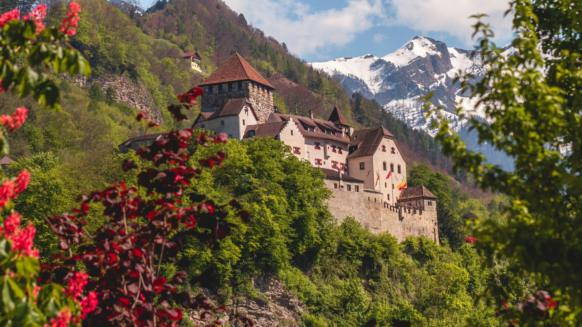 white and brown concrete building on mountain