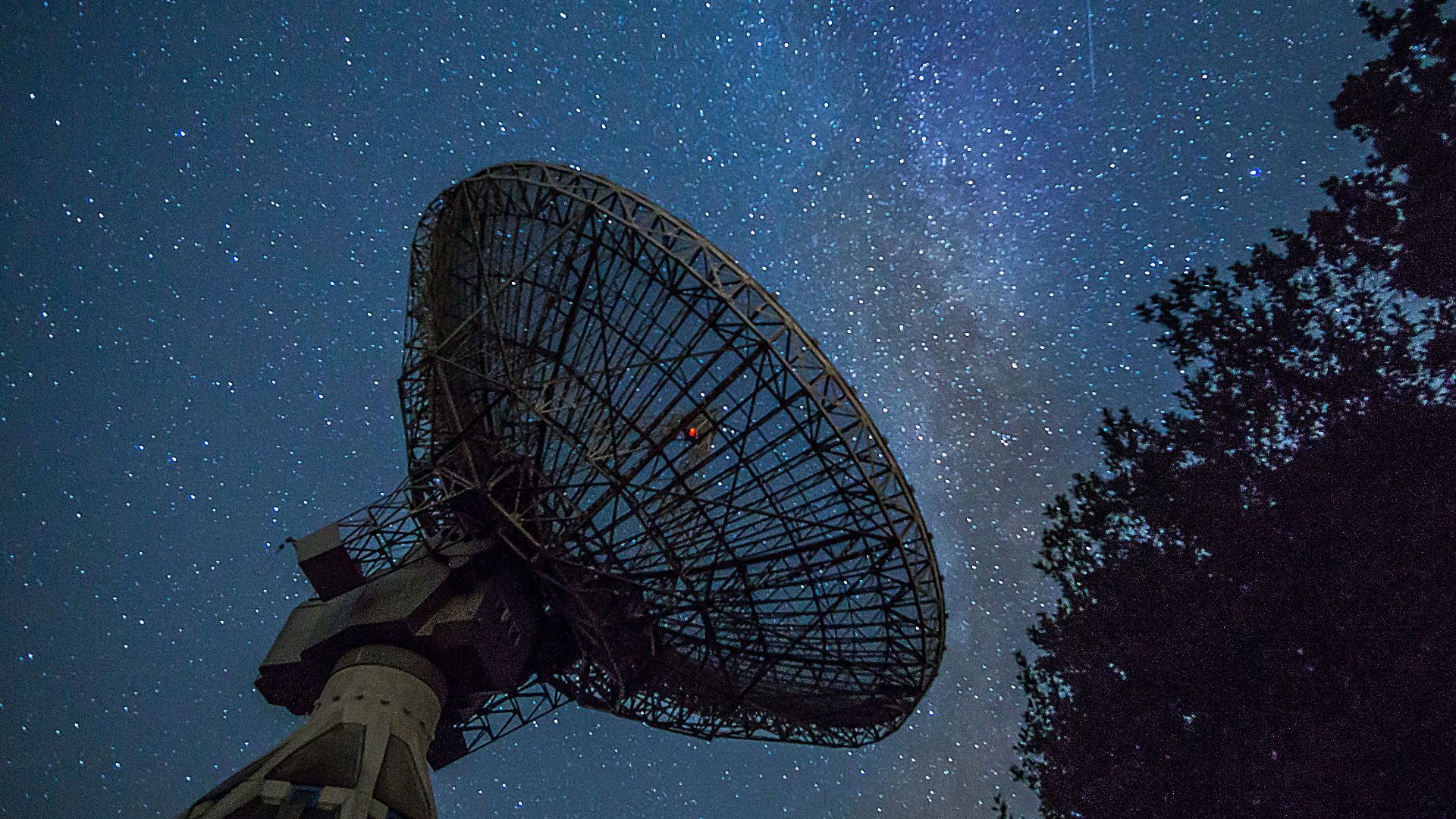 white satellite dish under blue sky during night time