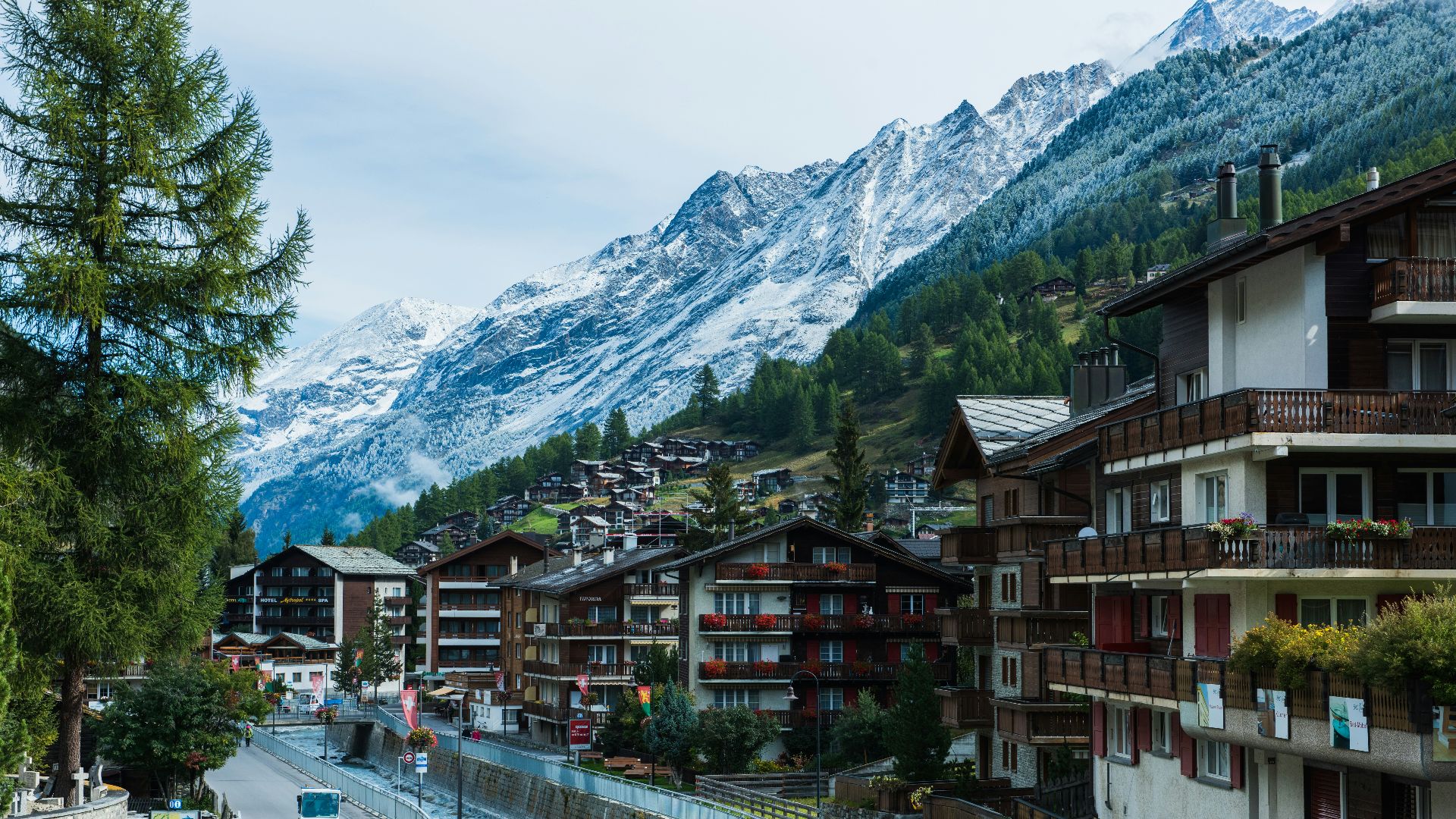 houses near road and mountain under blue sky during daytime photography