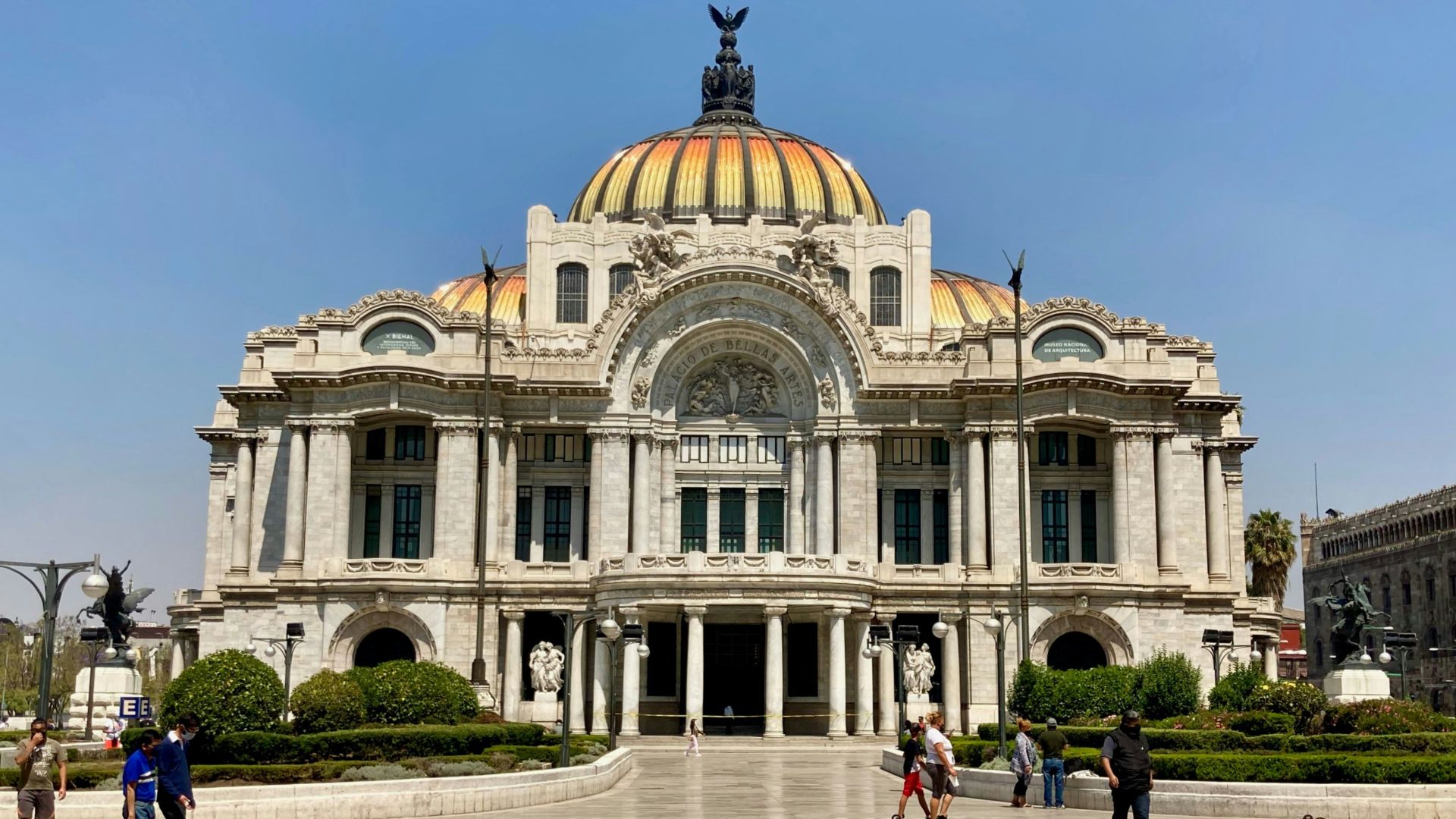 people walking near white concrete building during daytime