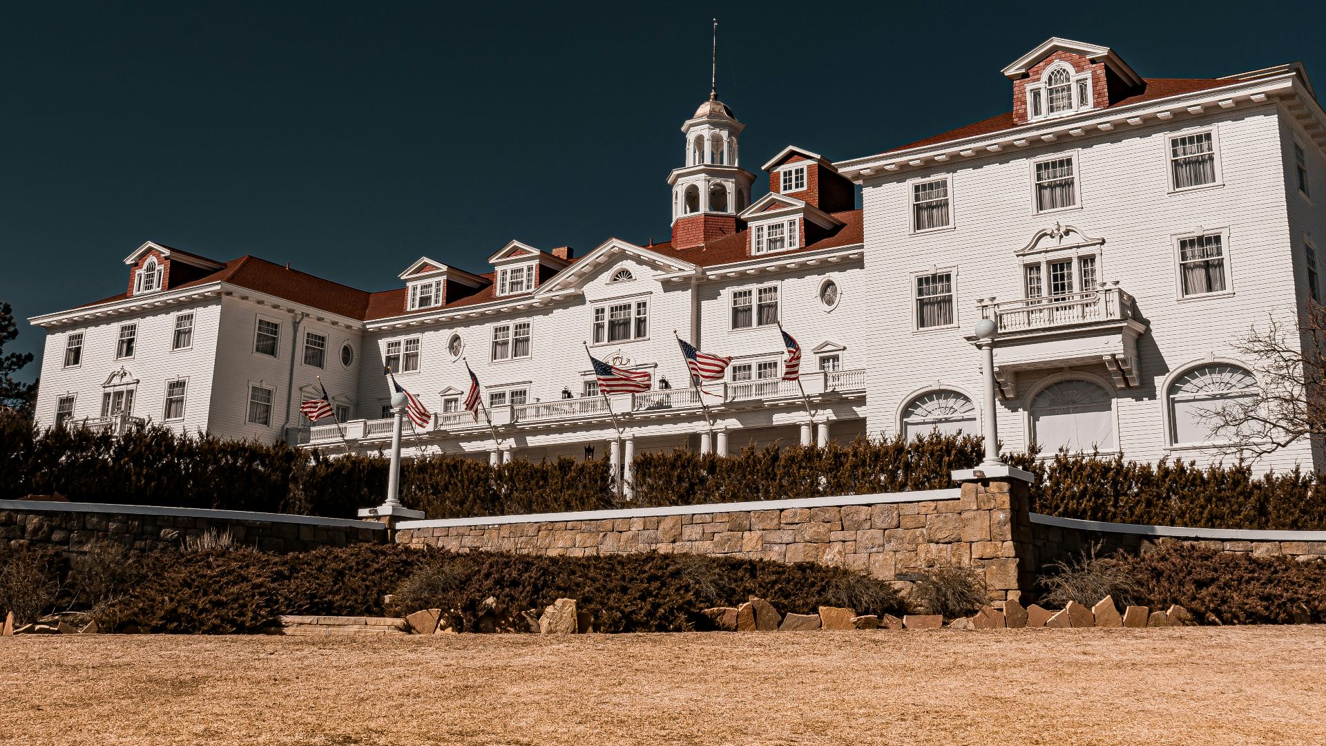 a large white building with a clock tower on top of it