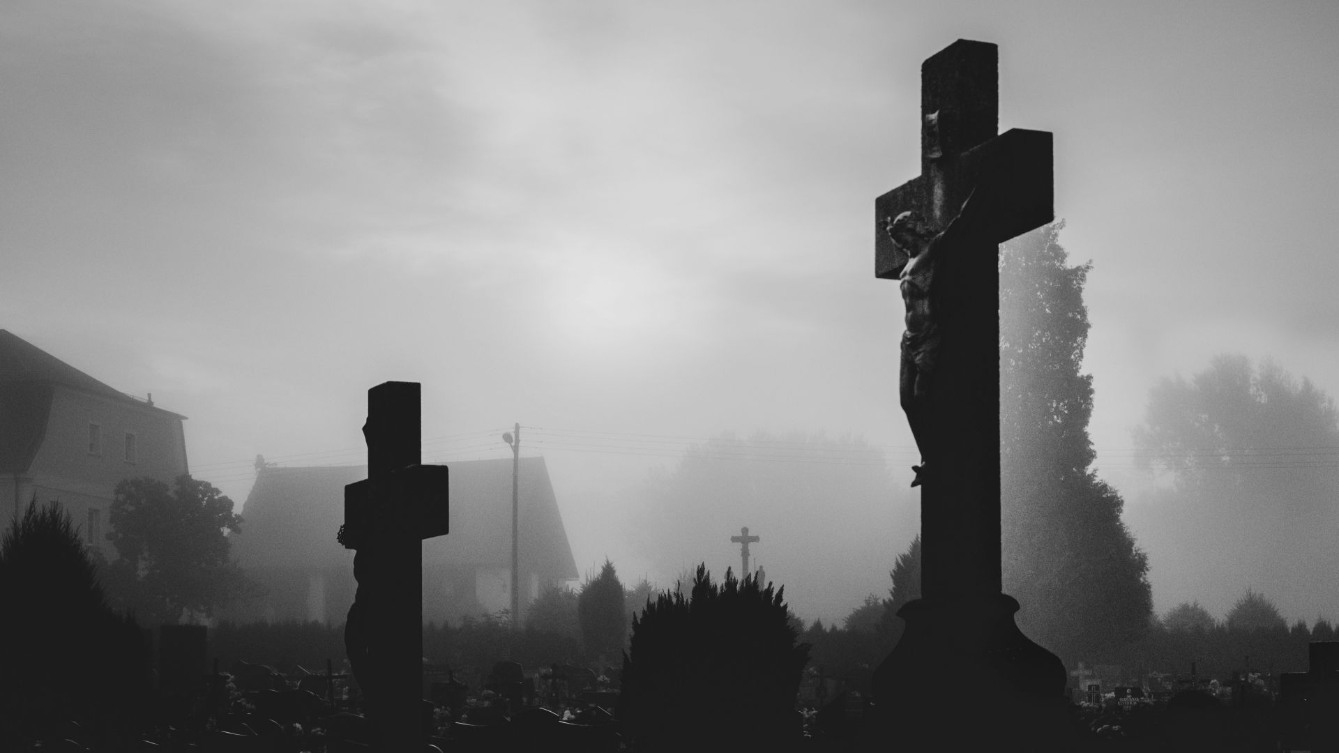 silhouette of cross under cloudy sky during daytime