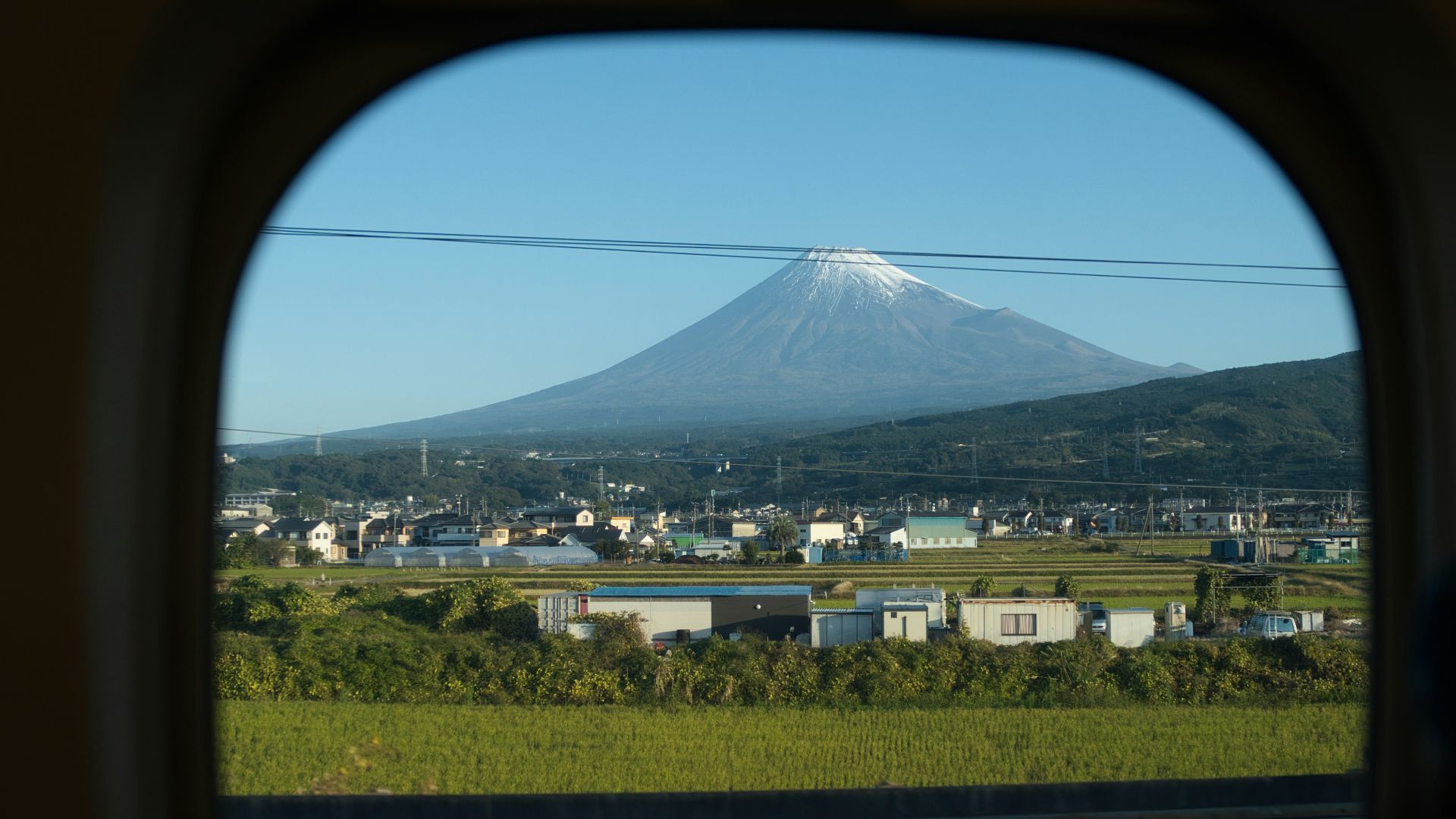 a view of a mountain from a train window