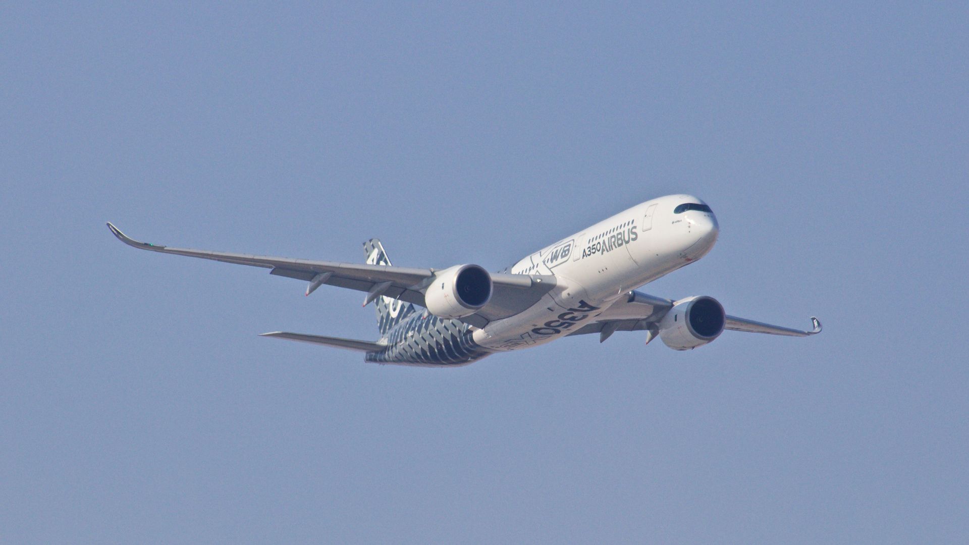 white airplane taking off during daytime