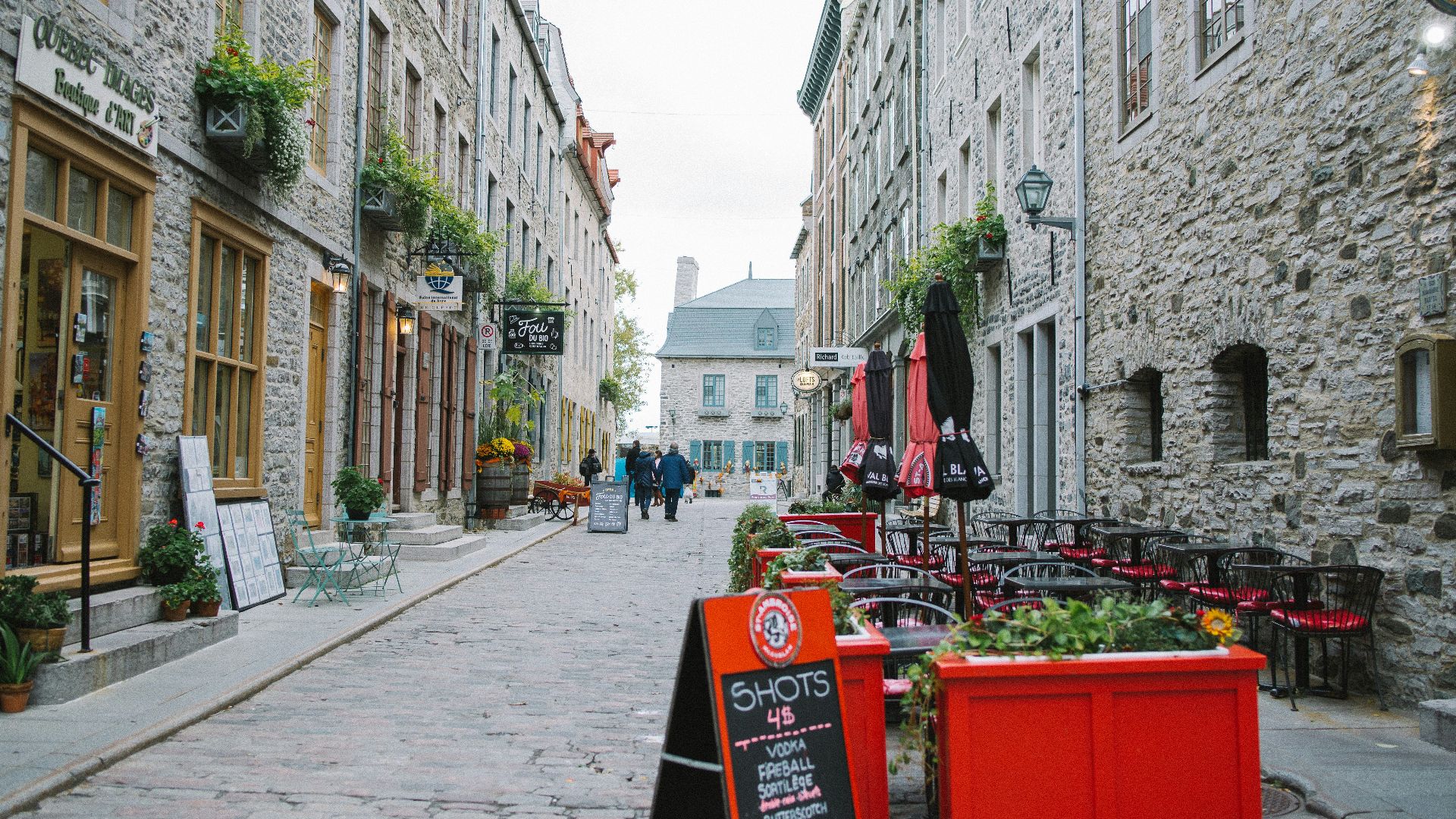 red coca cola box on sidewalk during daytime