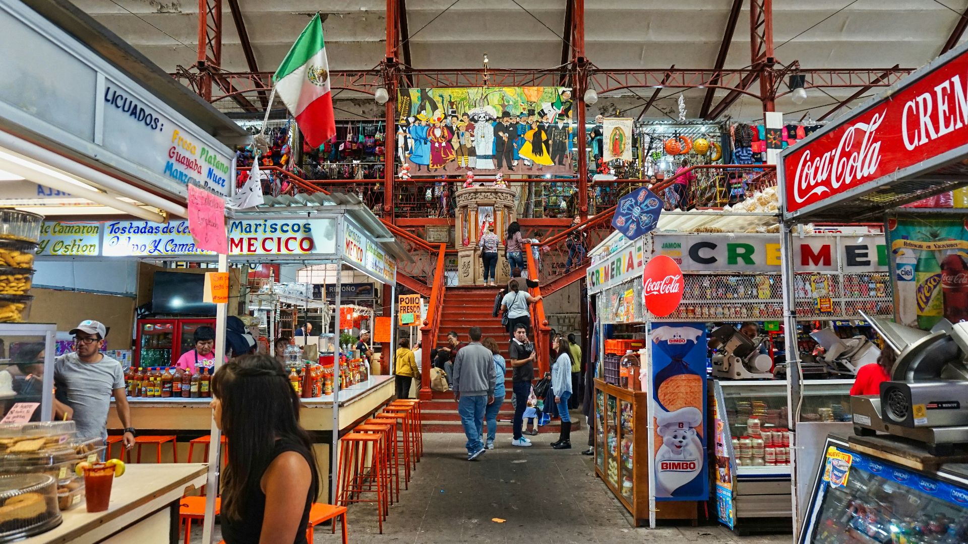 A store filled with lots of items and people