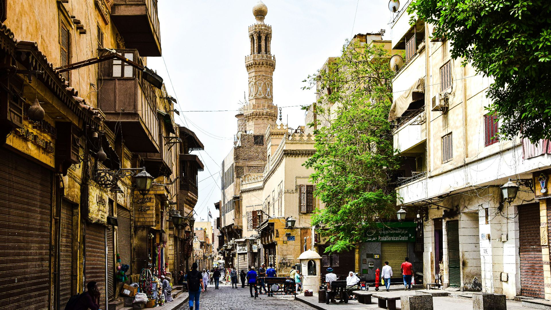 a street with buildings and people
