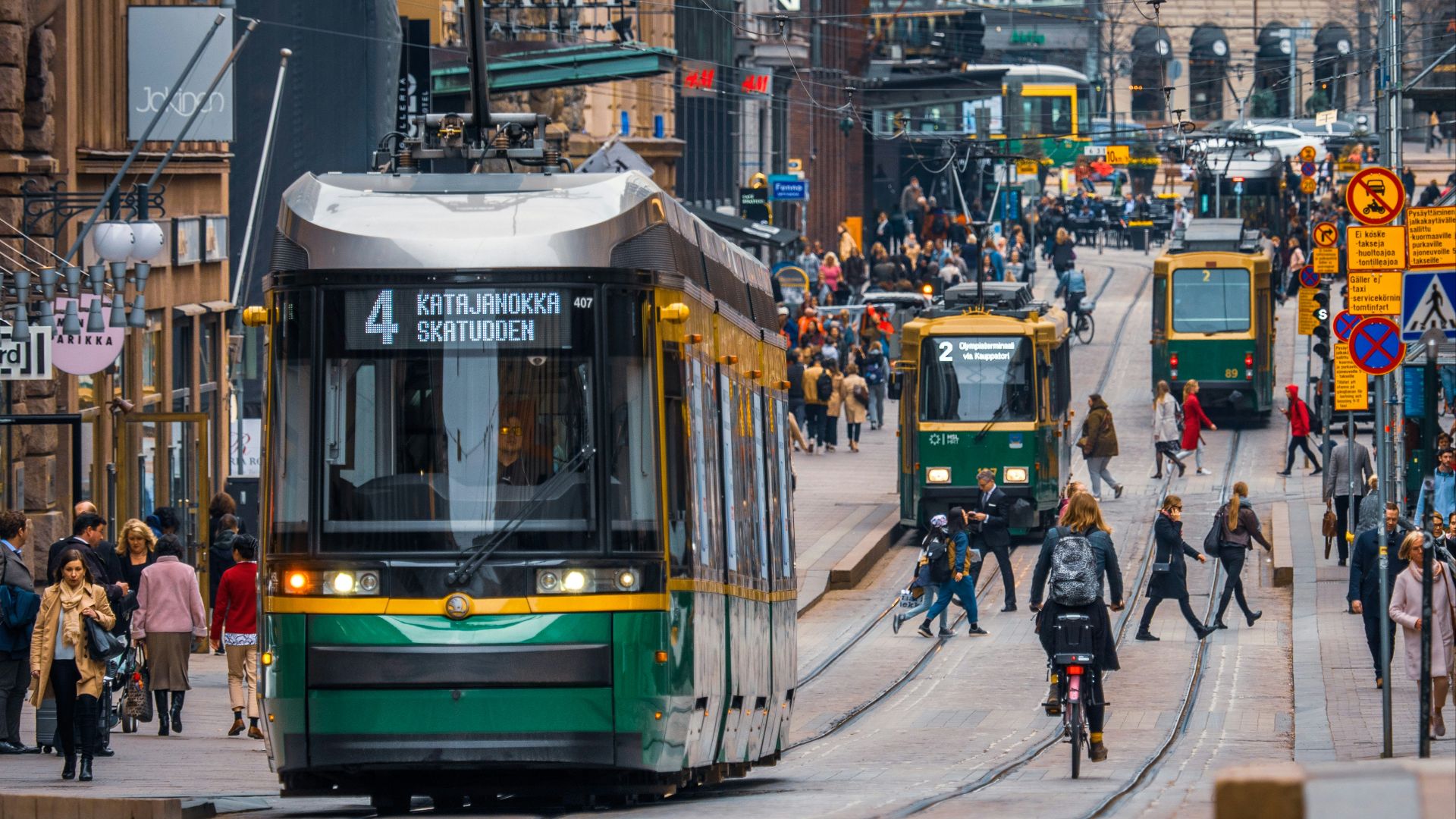 green and yellow city tram