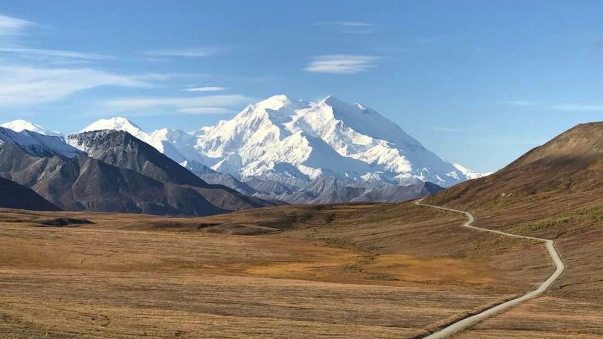brown and white mountains under blue sky during daytime