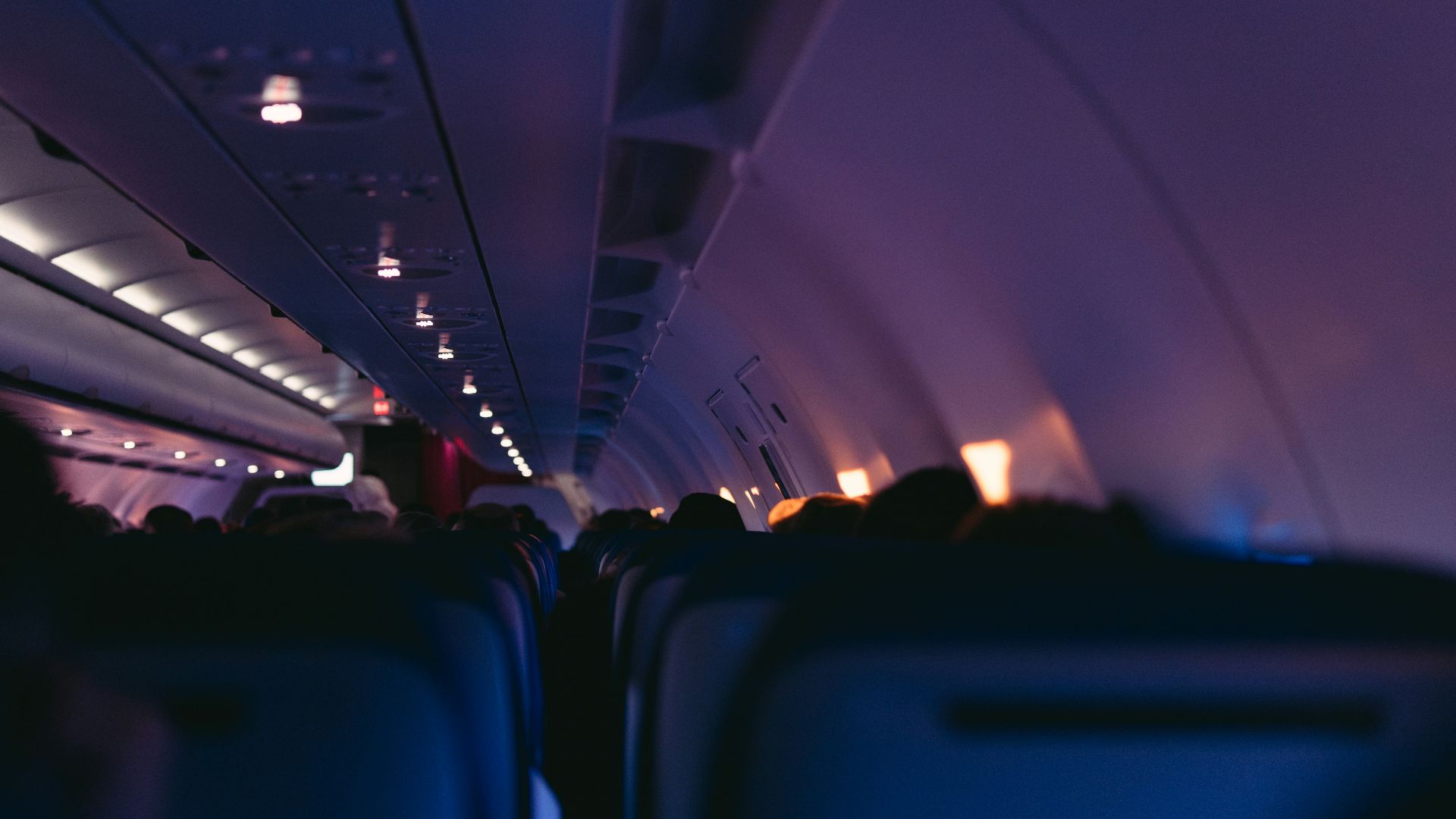 Inside an airplane cabin during a flight.