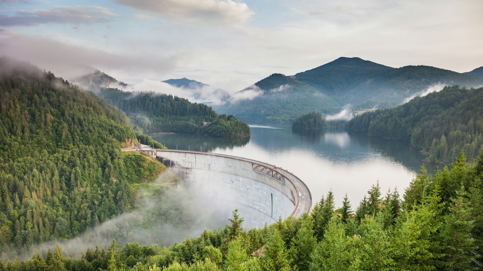 white bridge between mountains