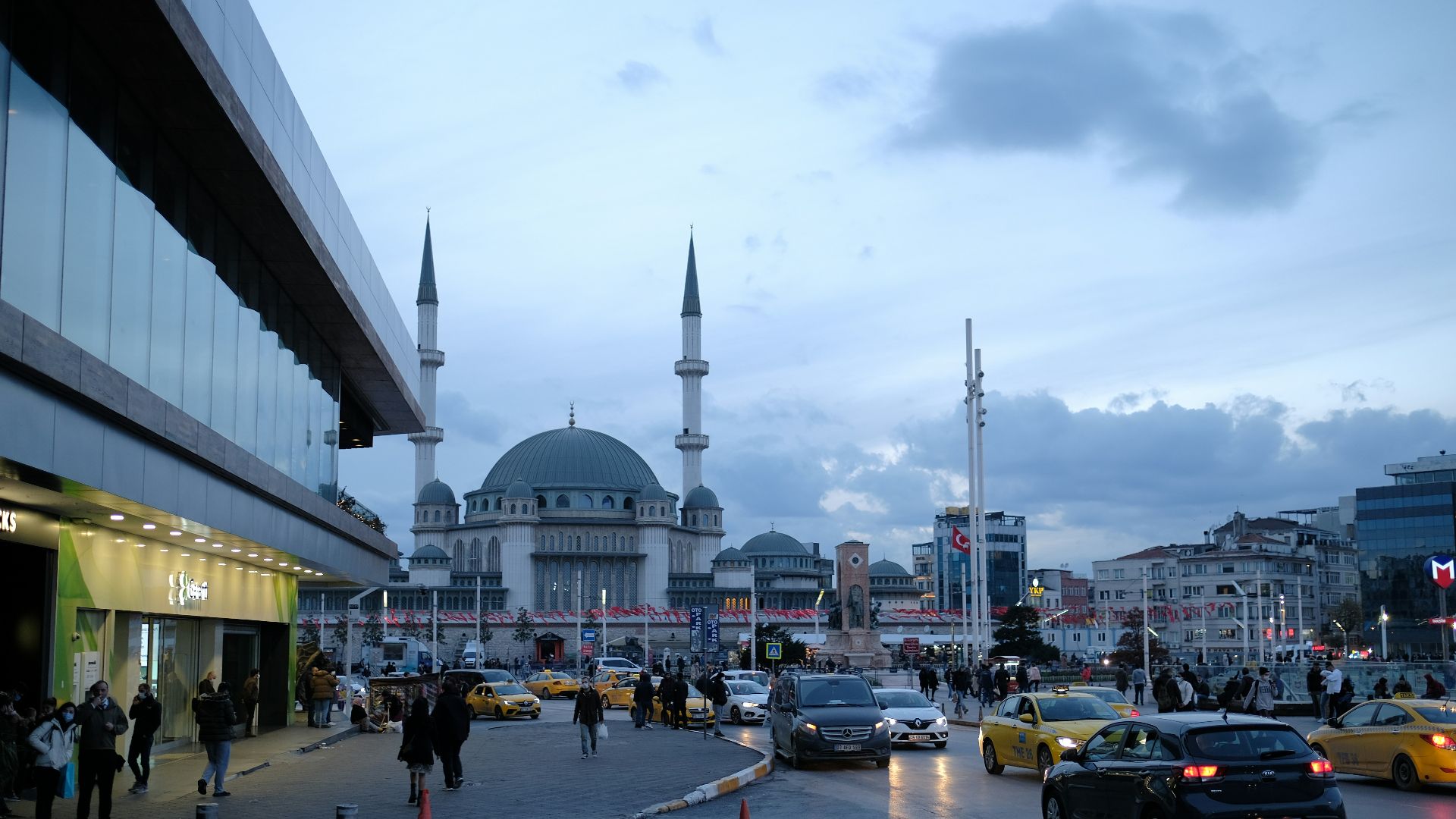 people walking on street near white dome building during daytime