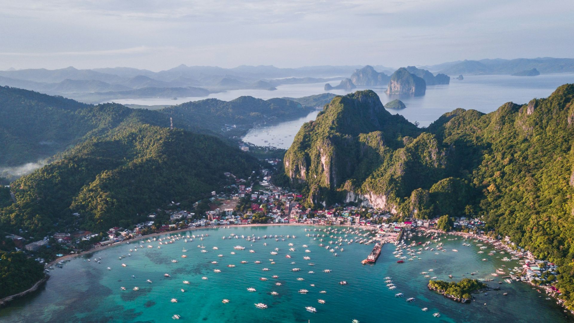 landscape photography of island with boats