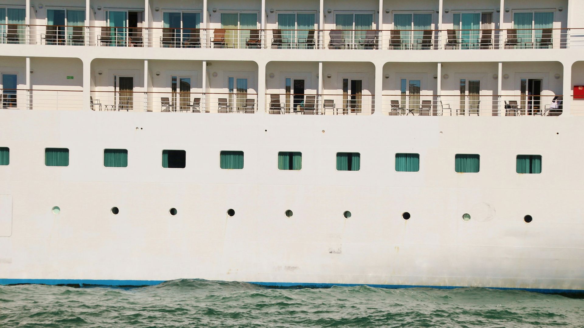 white and blue cruise ship on blue sea during daytime