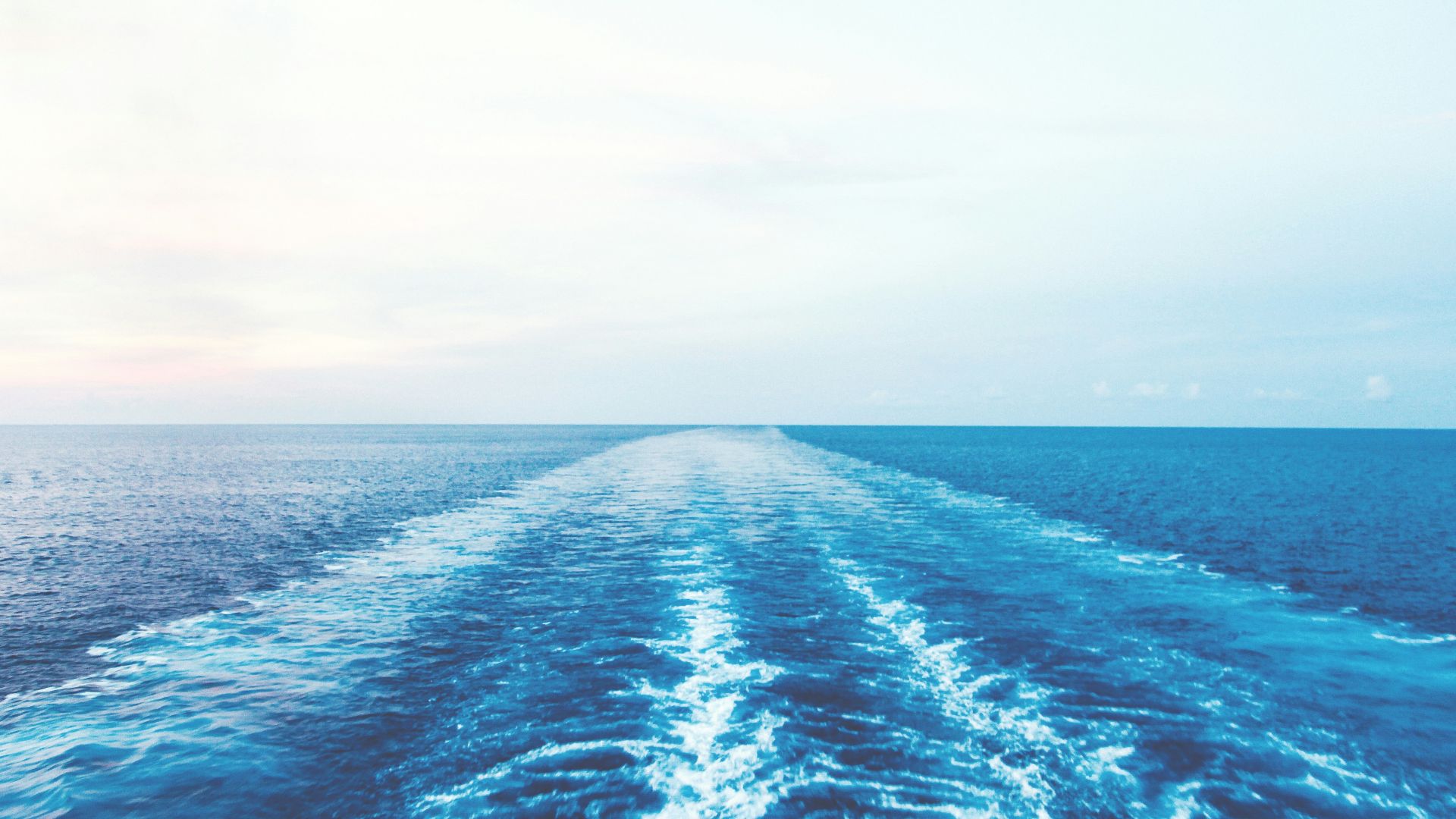 blue ocean water under white sky