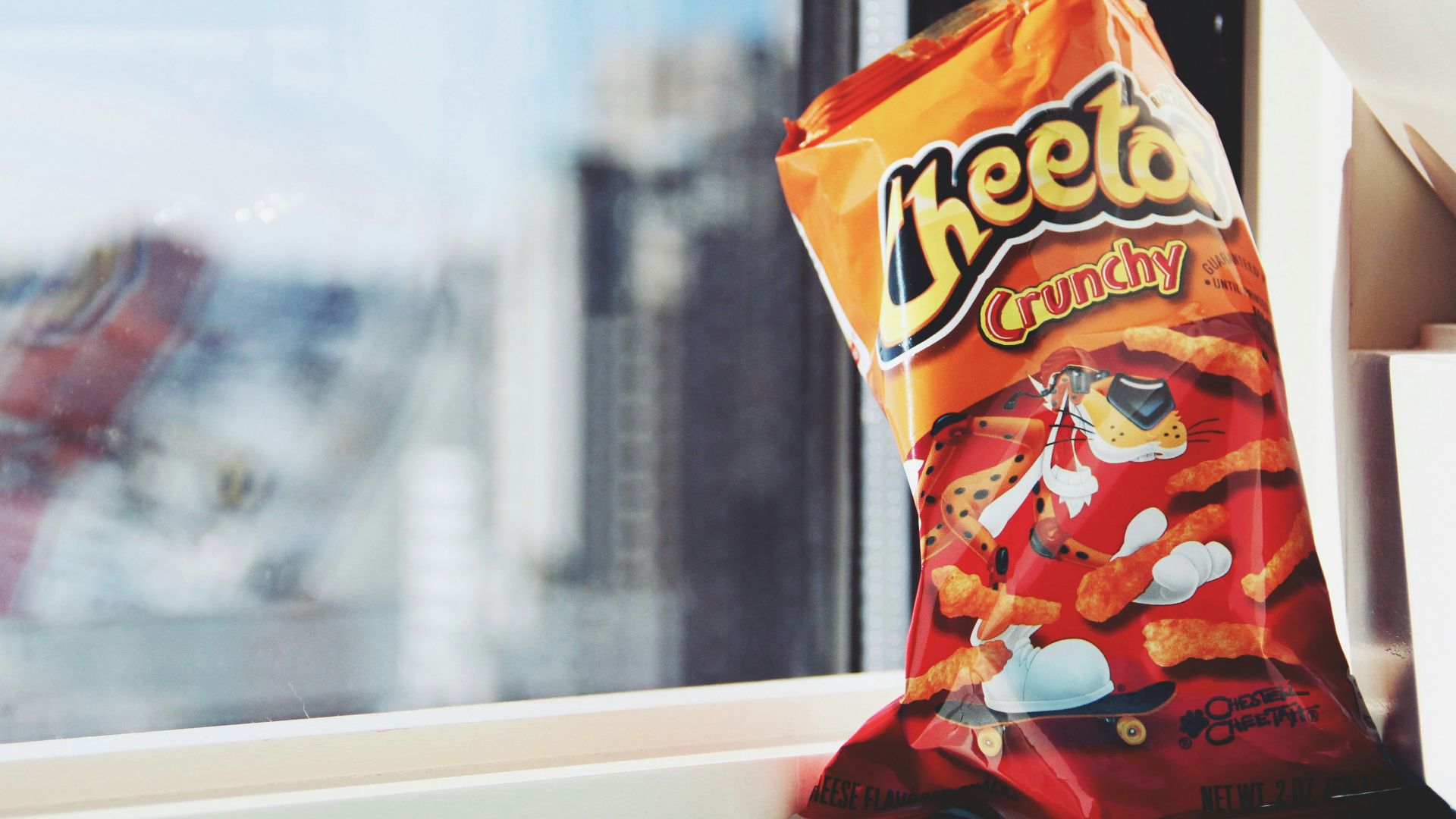 orange and yellow plastic pack on white table